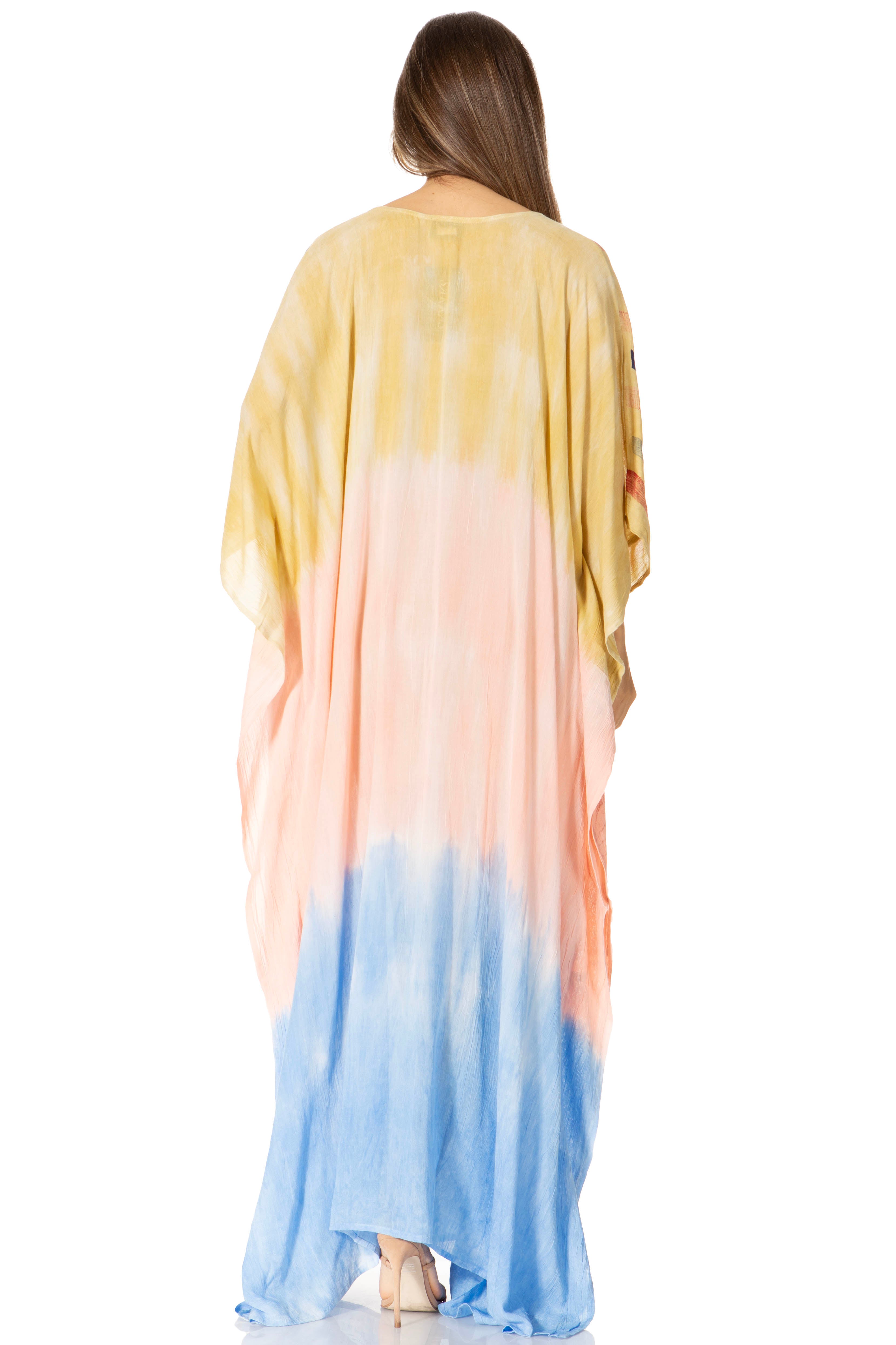 Woman wearing a colorful gradient dress with yellow, pink, and blue at the back on a white background