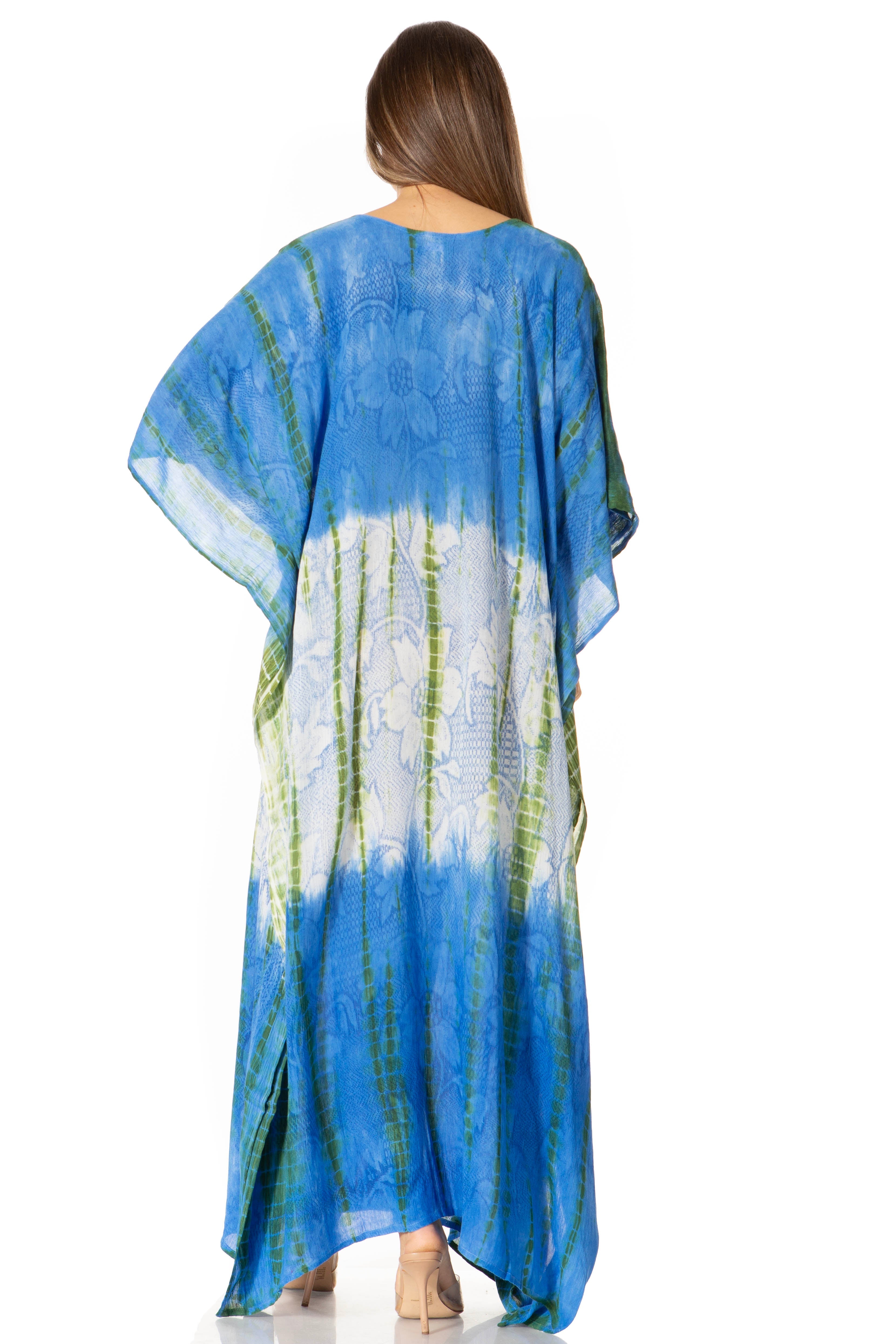 Woman wearing a blue tie-dye dress with a white background