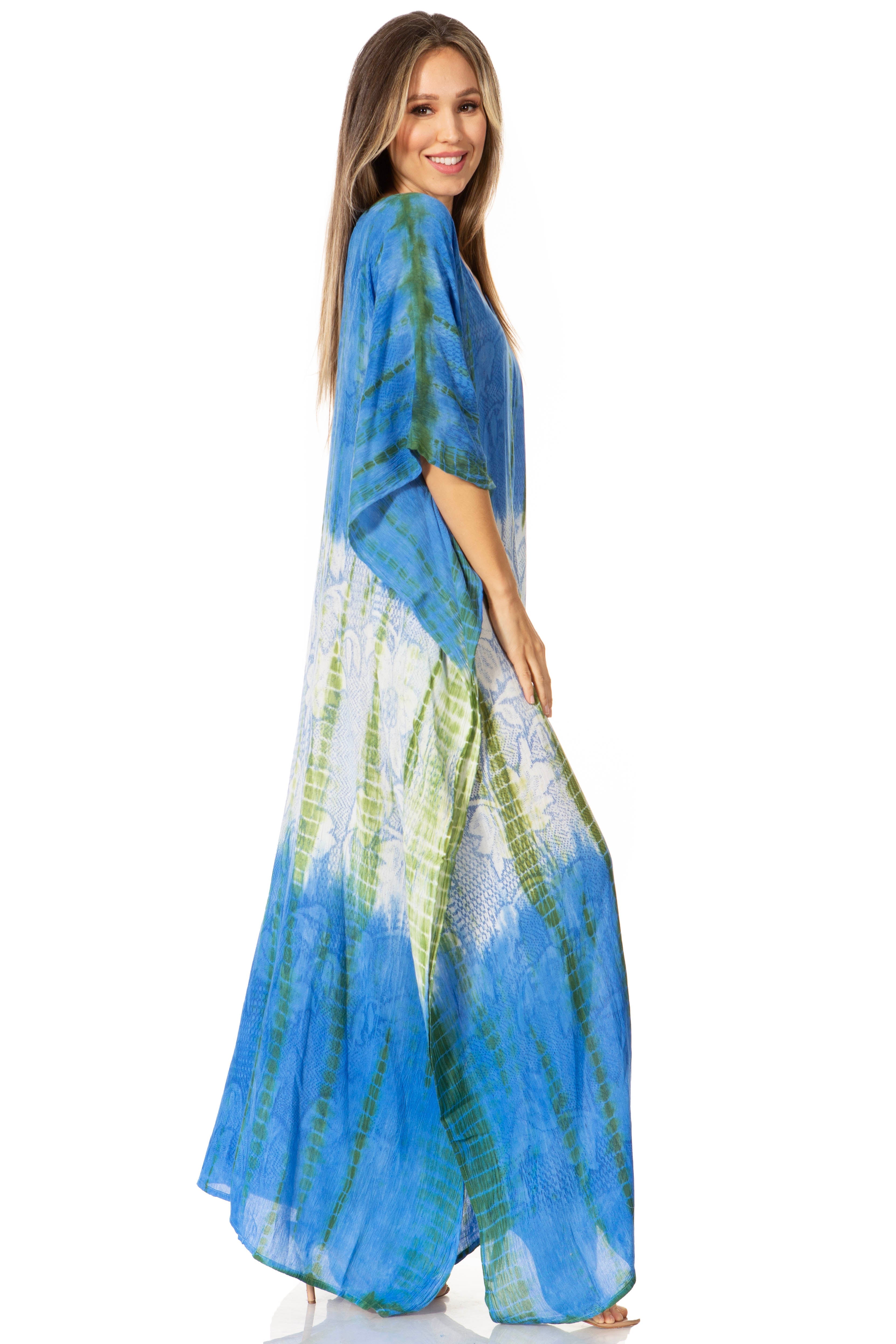 Woman wearing a blue and green gradient dress on a white background