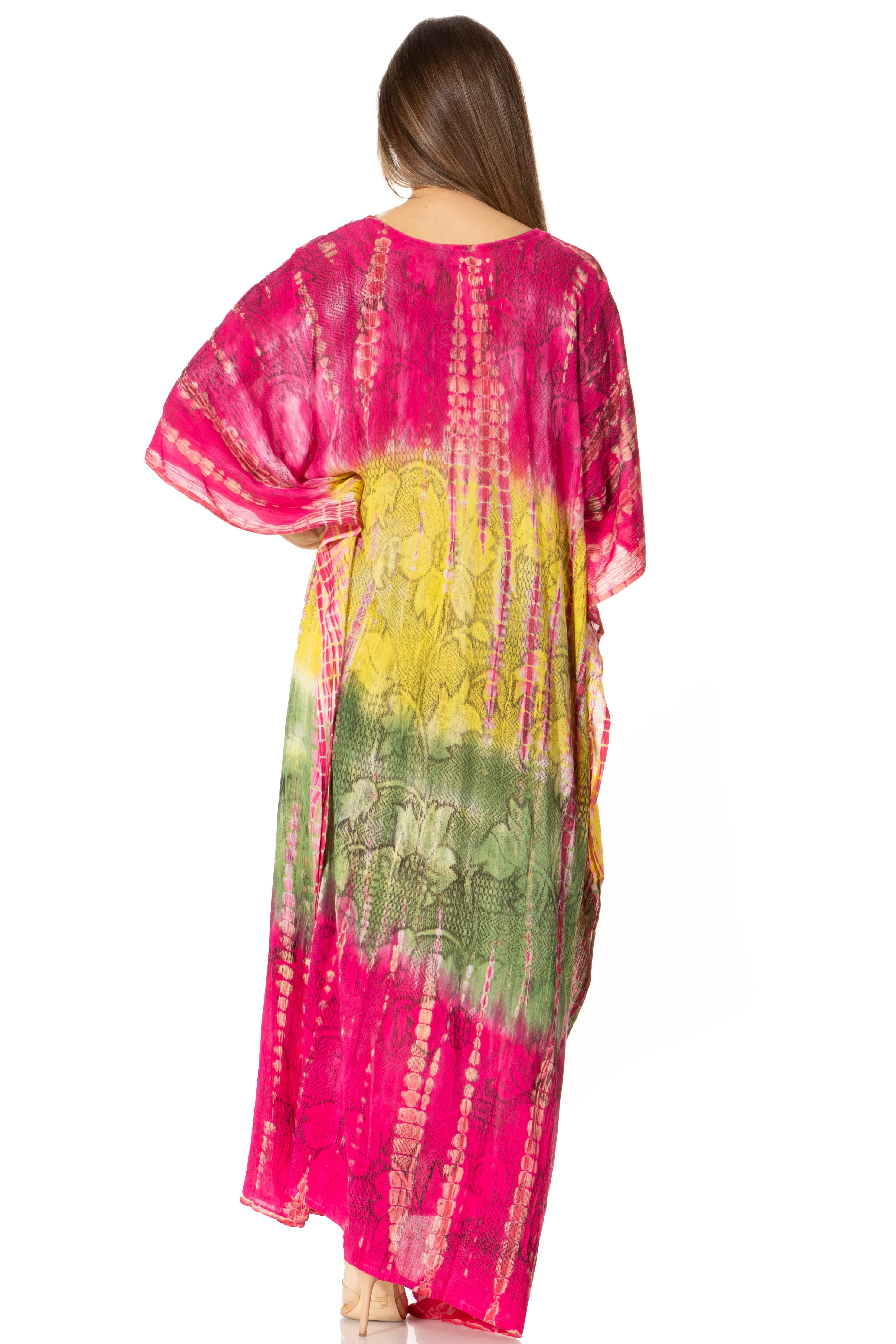 Woman wearing a colorful tie-dye kimono-style dress with pink, yellow, and green gradient.