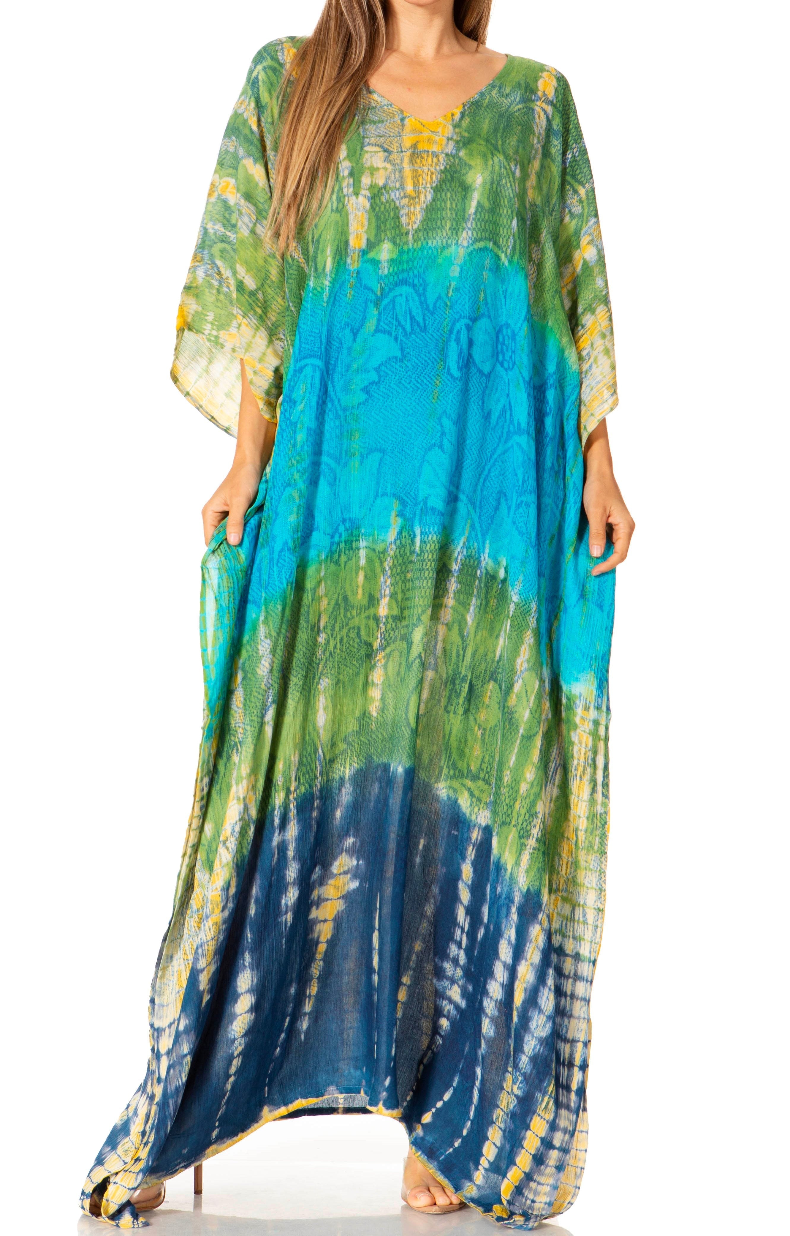 Long, colorful tie-dye dress with a gradient from green to blue on a white background.