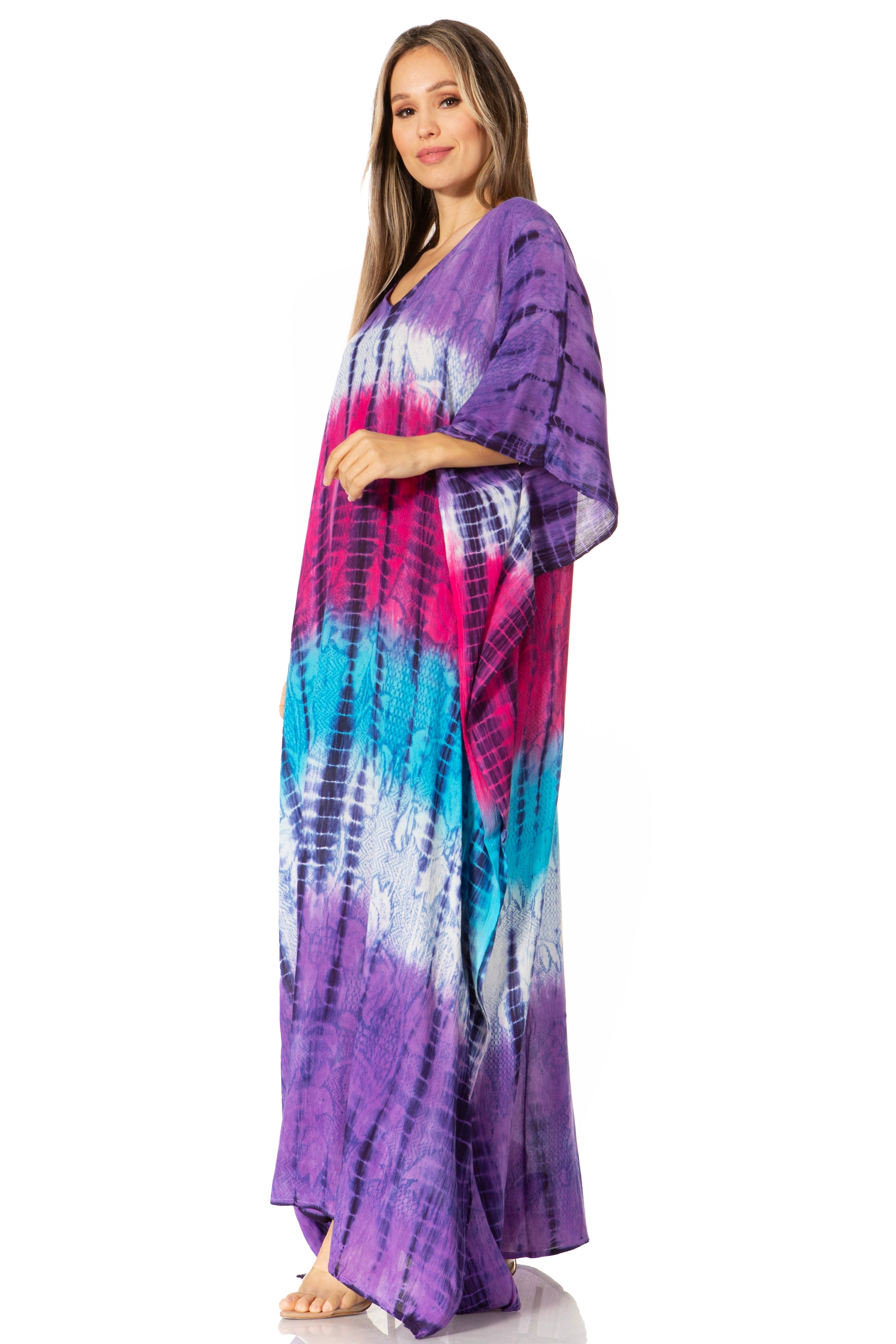 Woman wearing a tie-dye dress with purple, pink, and blue colors on a white background