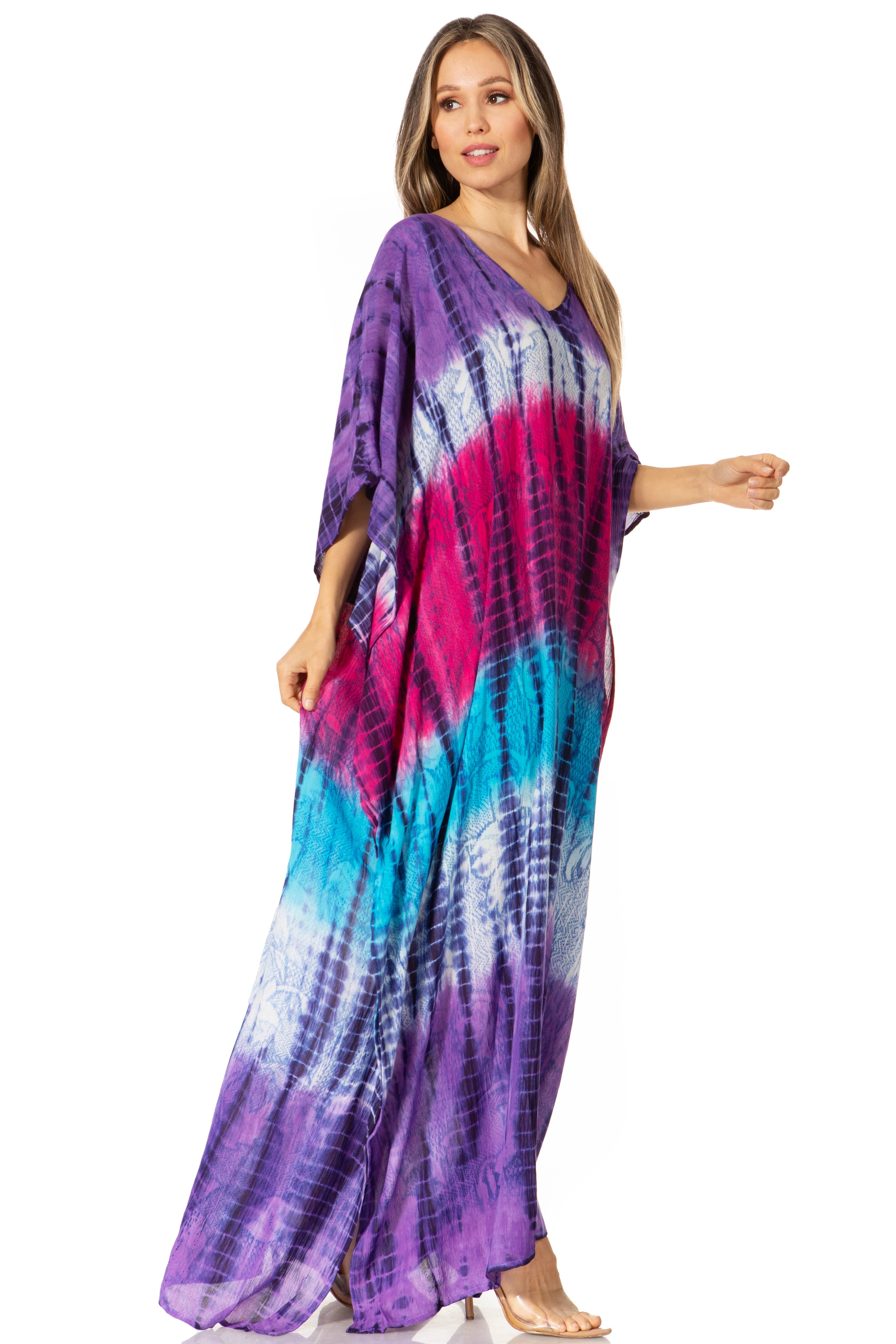 Woman wearing a tie-dye dress with purple, pink, and blue colors on a white background