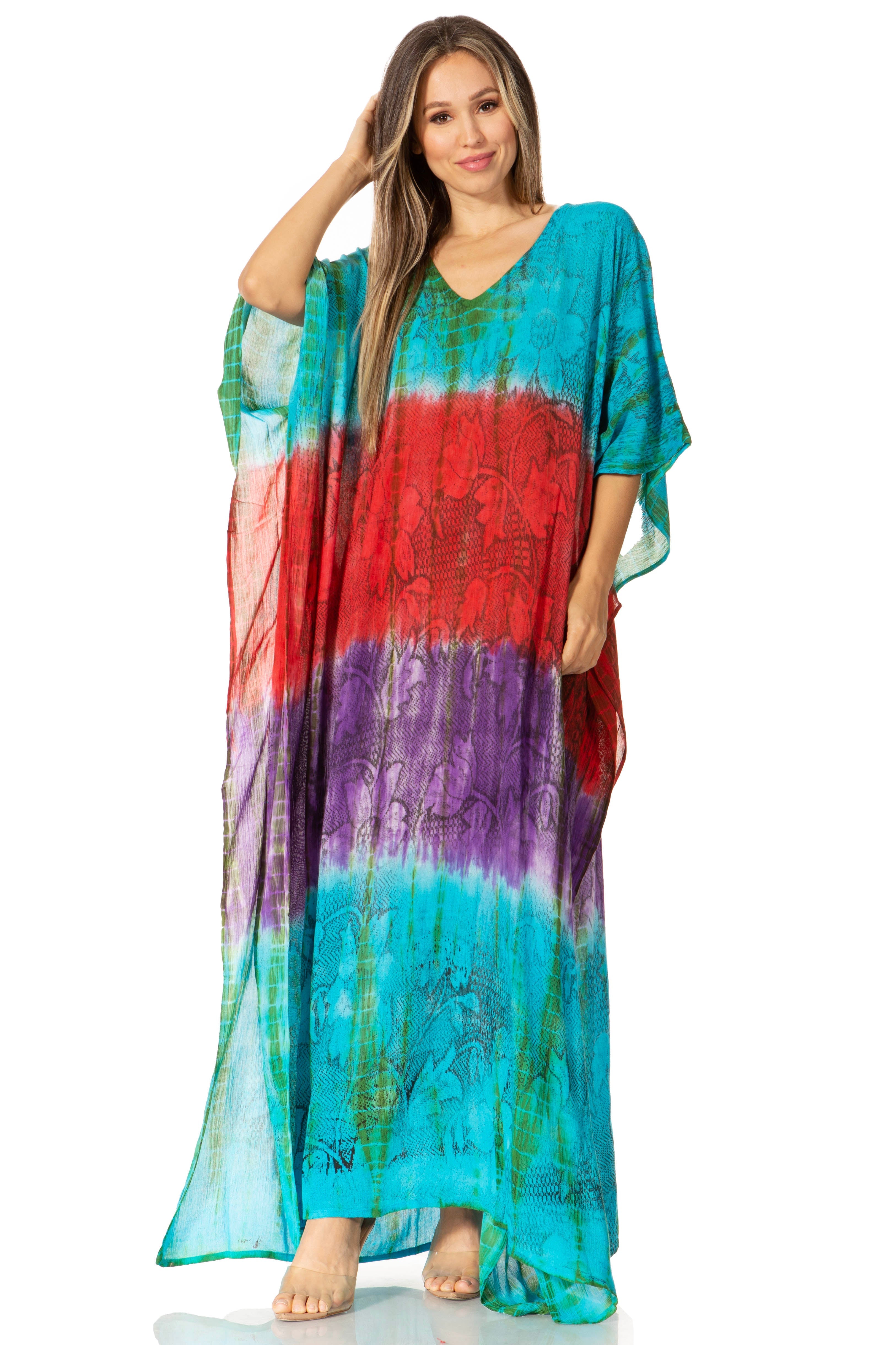 Woman wearing a colorful tie-dye dress on a white background
