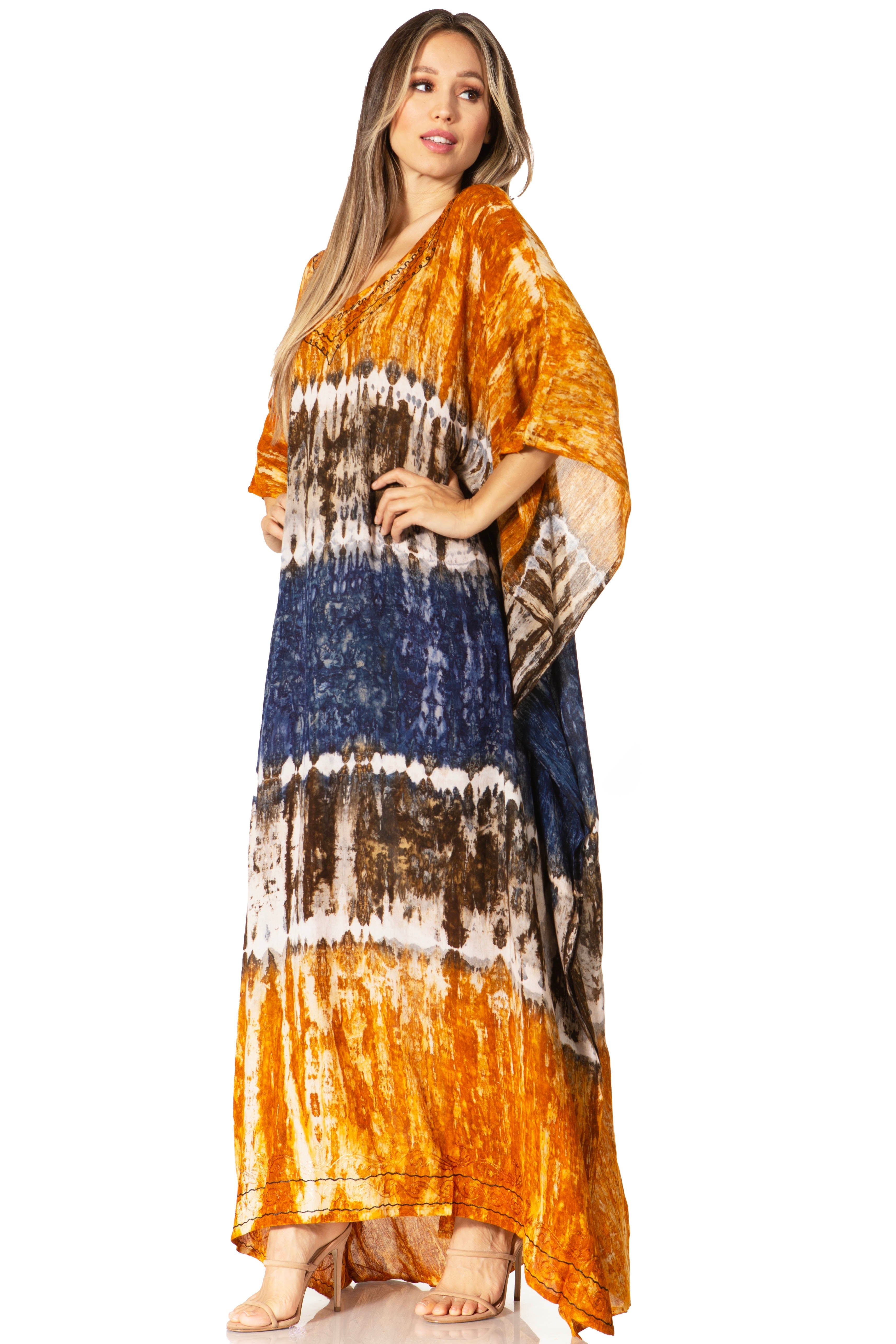 Woman wearing a tie-dye dress with orange, blue, and brown patterns on a white background