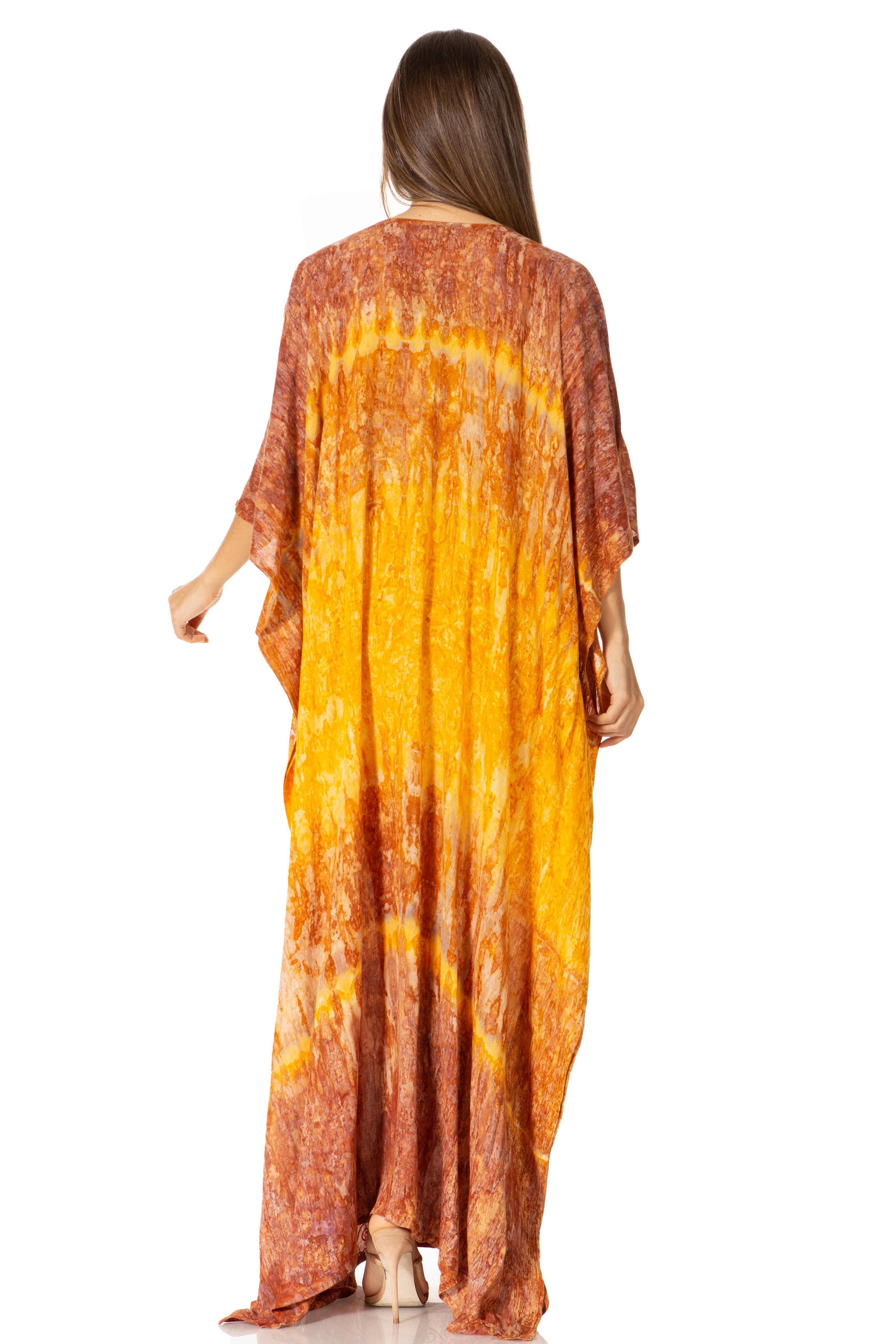 Woman wearing a tie-dye dress with orange and yellow gradient on a white background