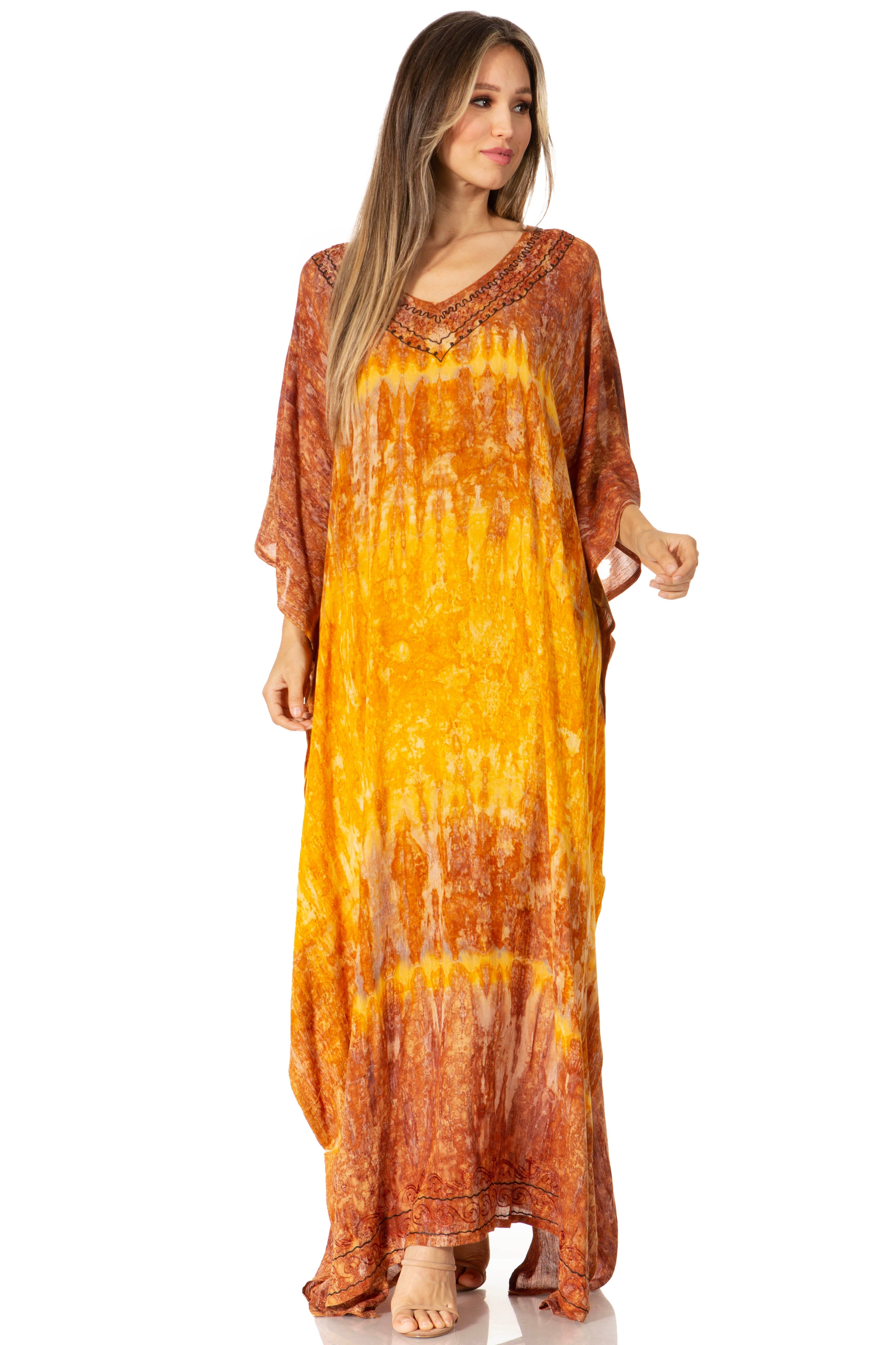 Woman wearing a long, orange tie-dye dress on a white background