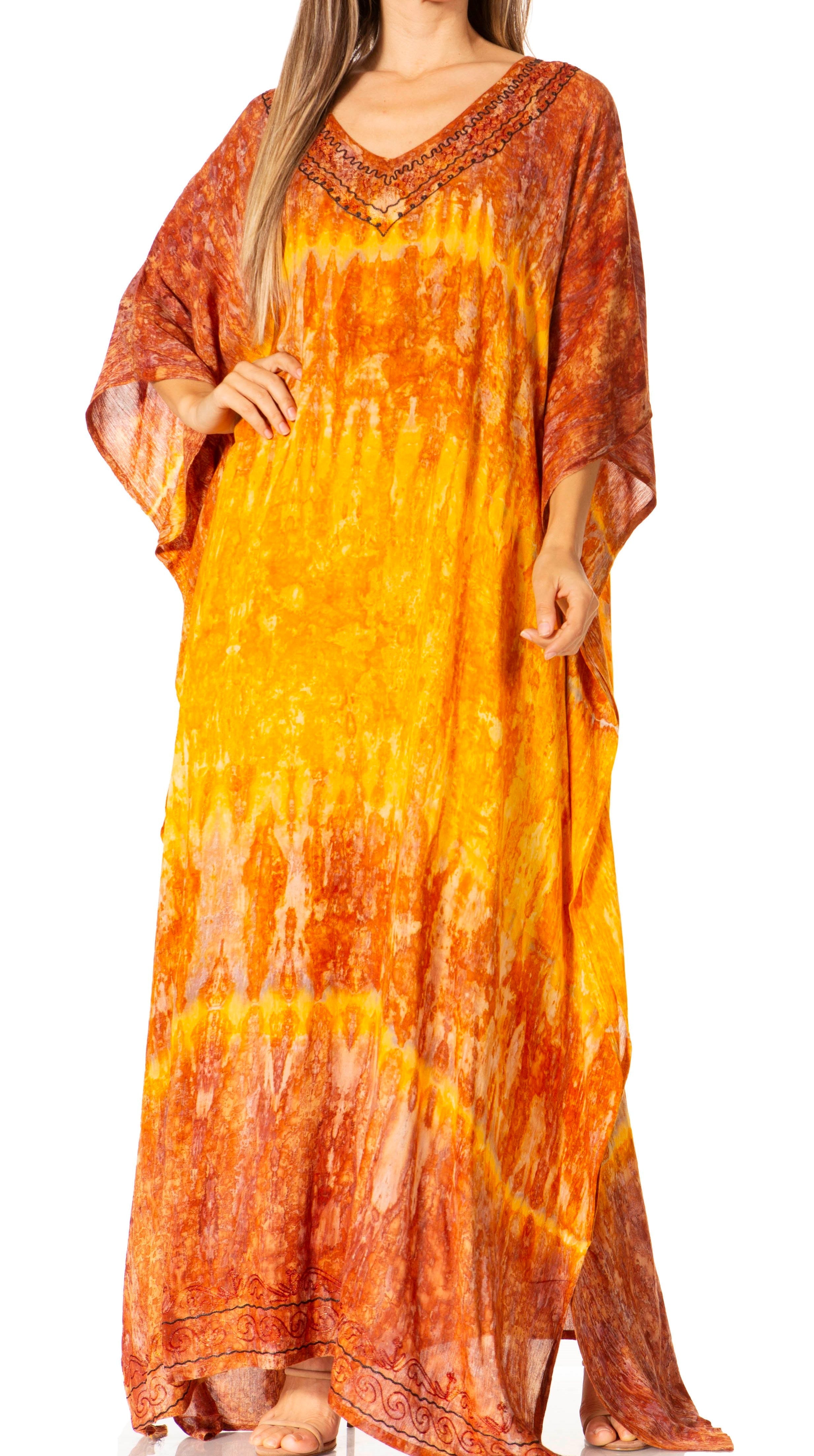 Orange and yellow tie-dye dress worn by a model on a white background