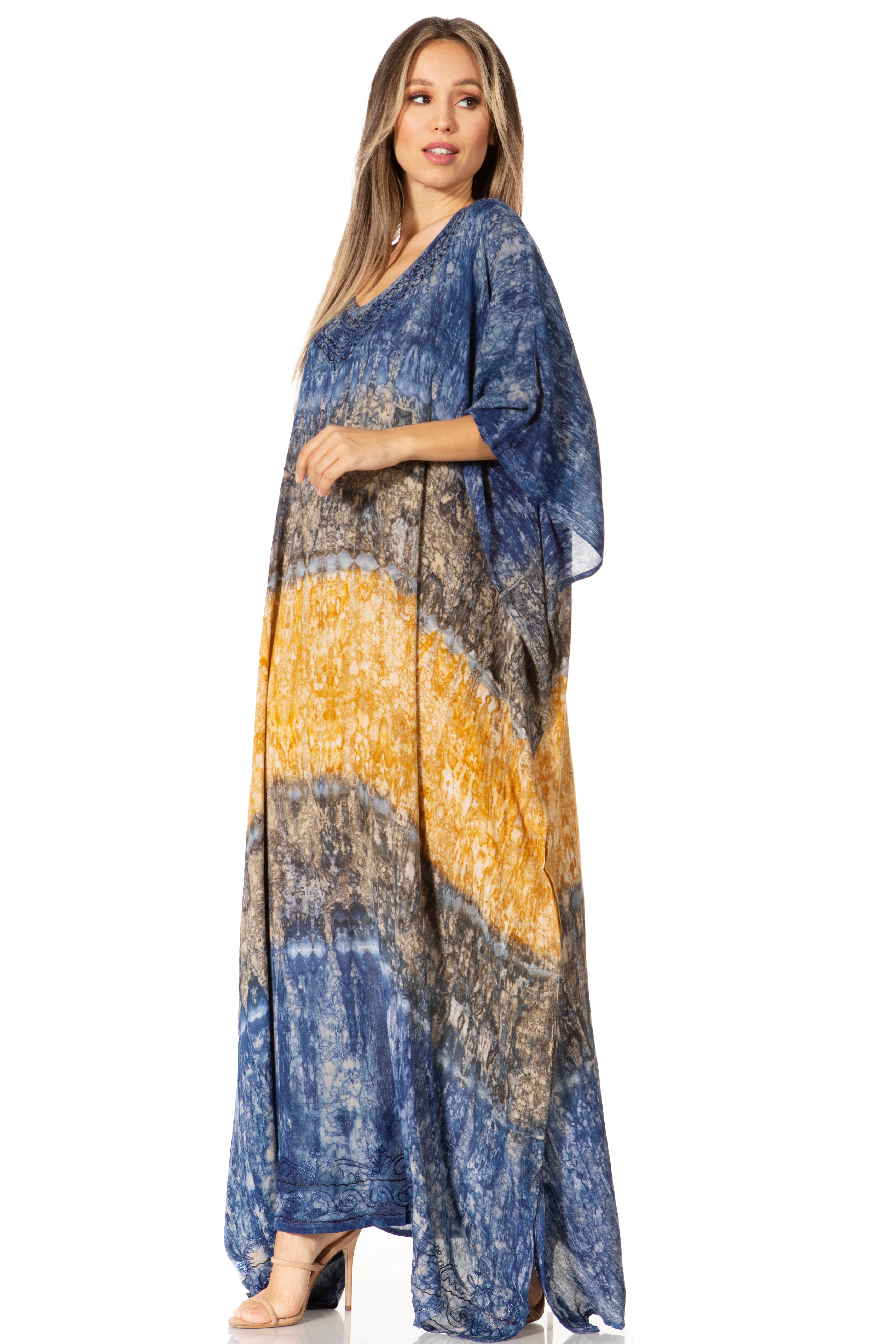 Woman wearing a long, patterned dress with a gradient of blue, yellow, and gray on a white background.