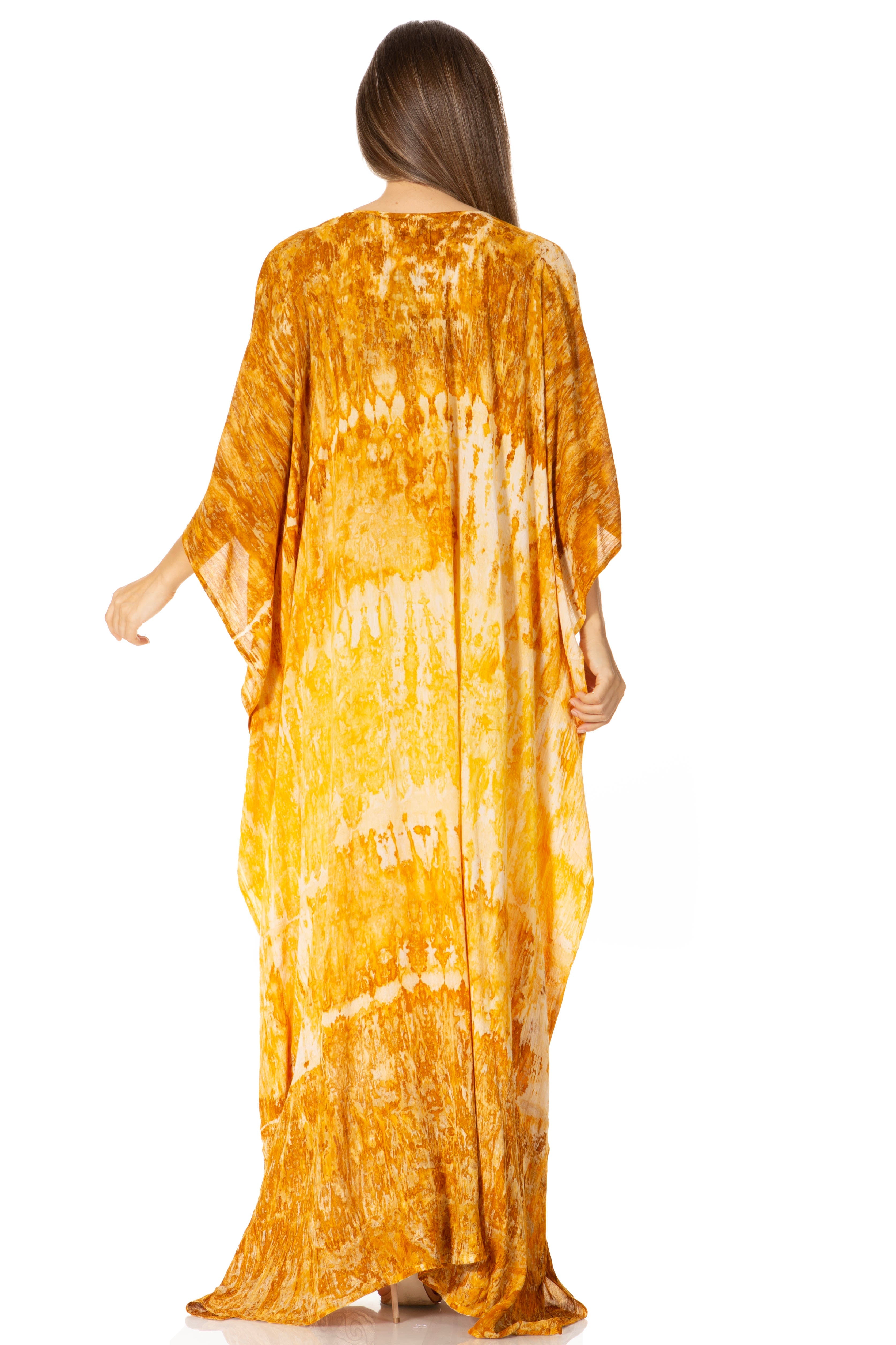 Woman wearing a yellow tie-dye dress on a white background