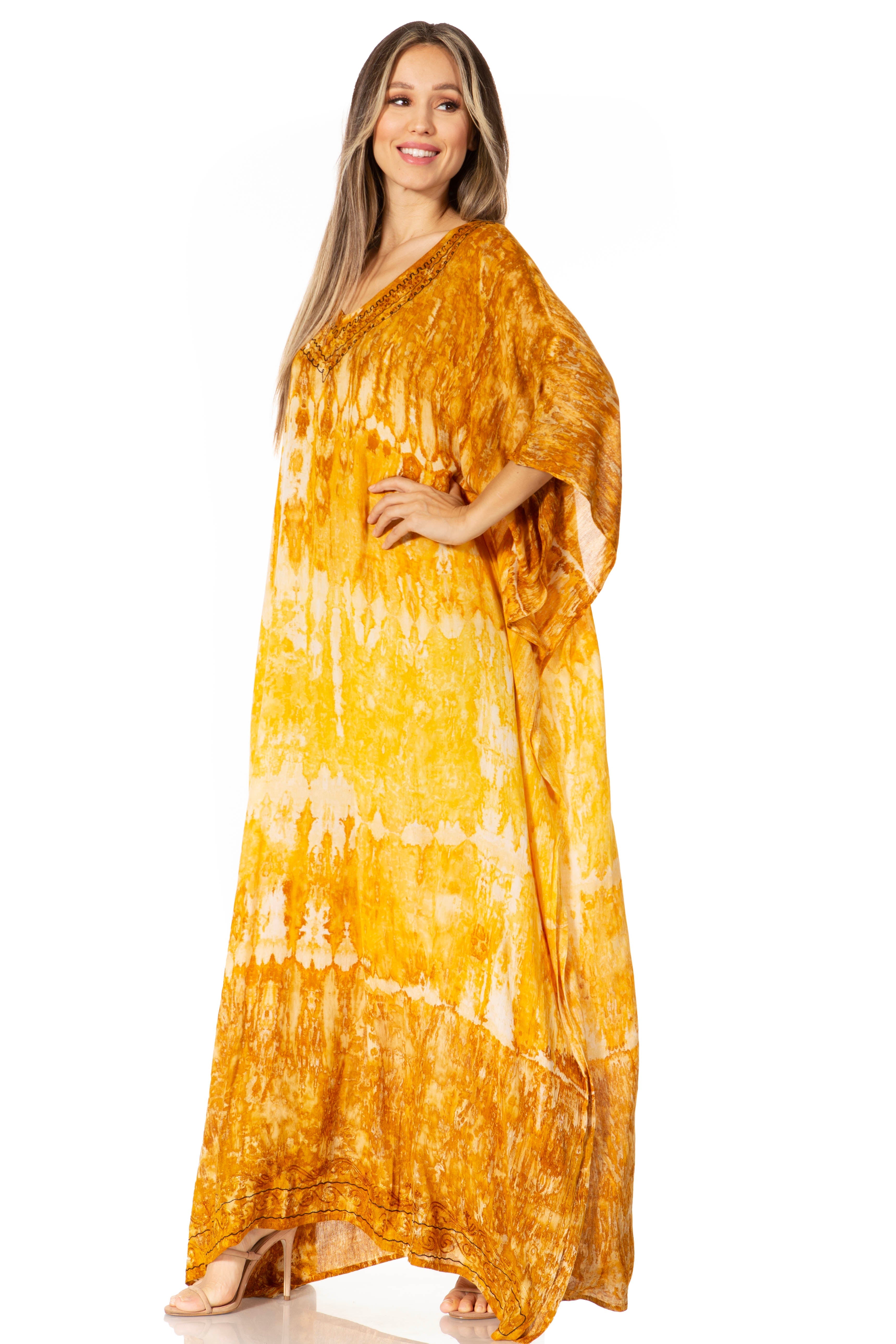 Woman wearing a yellow tie-dye dress on a white background