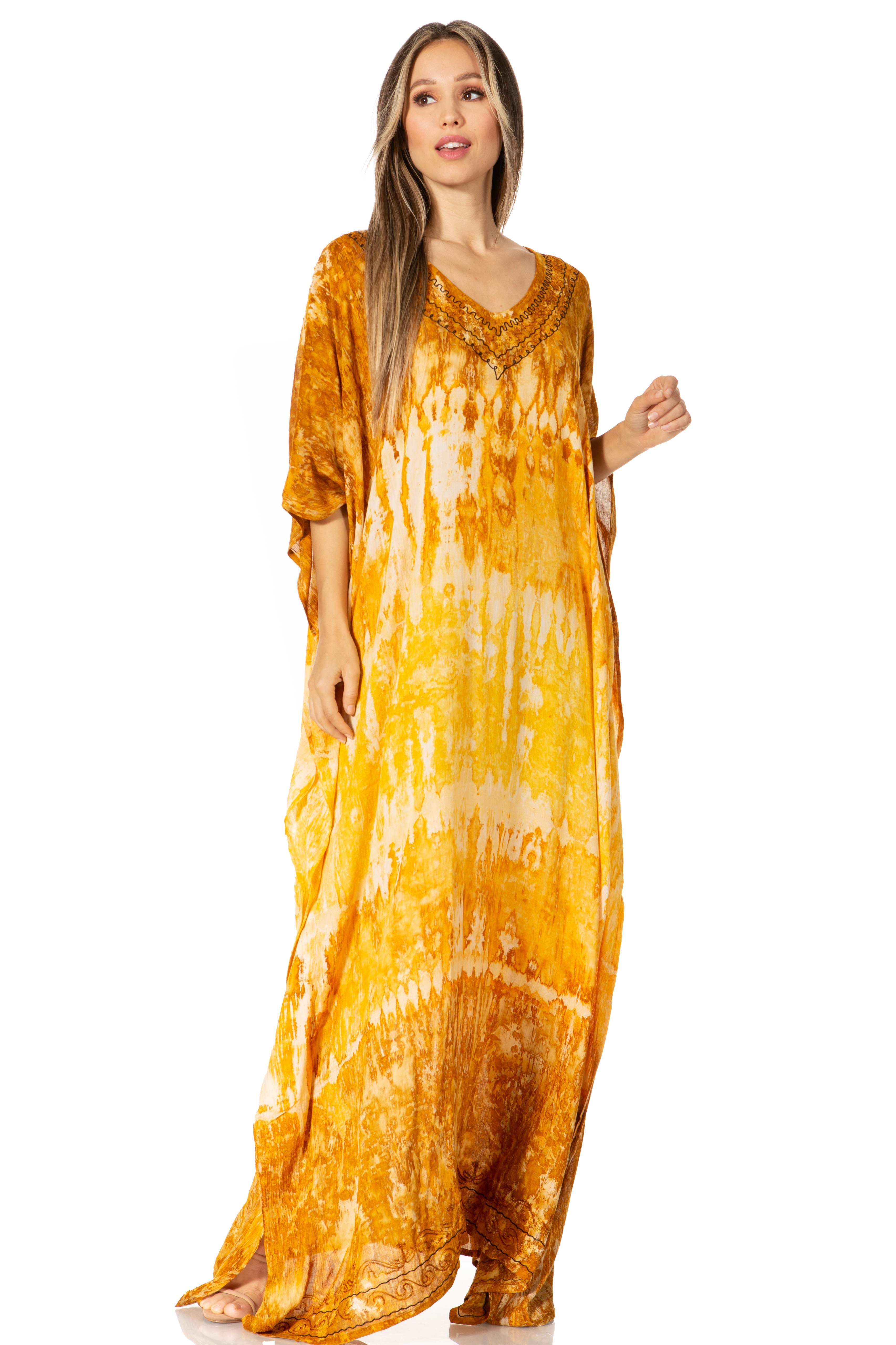 Woman wearing a yellow tie-dye dress on a white background