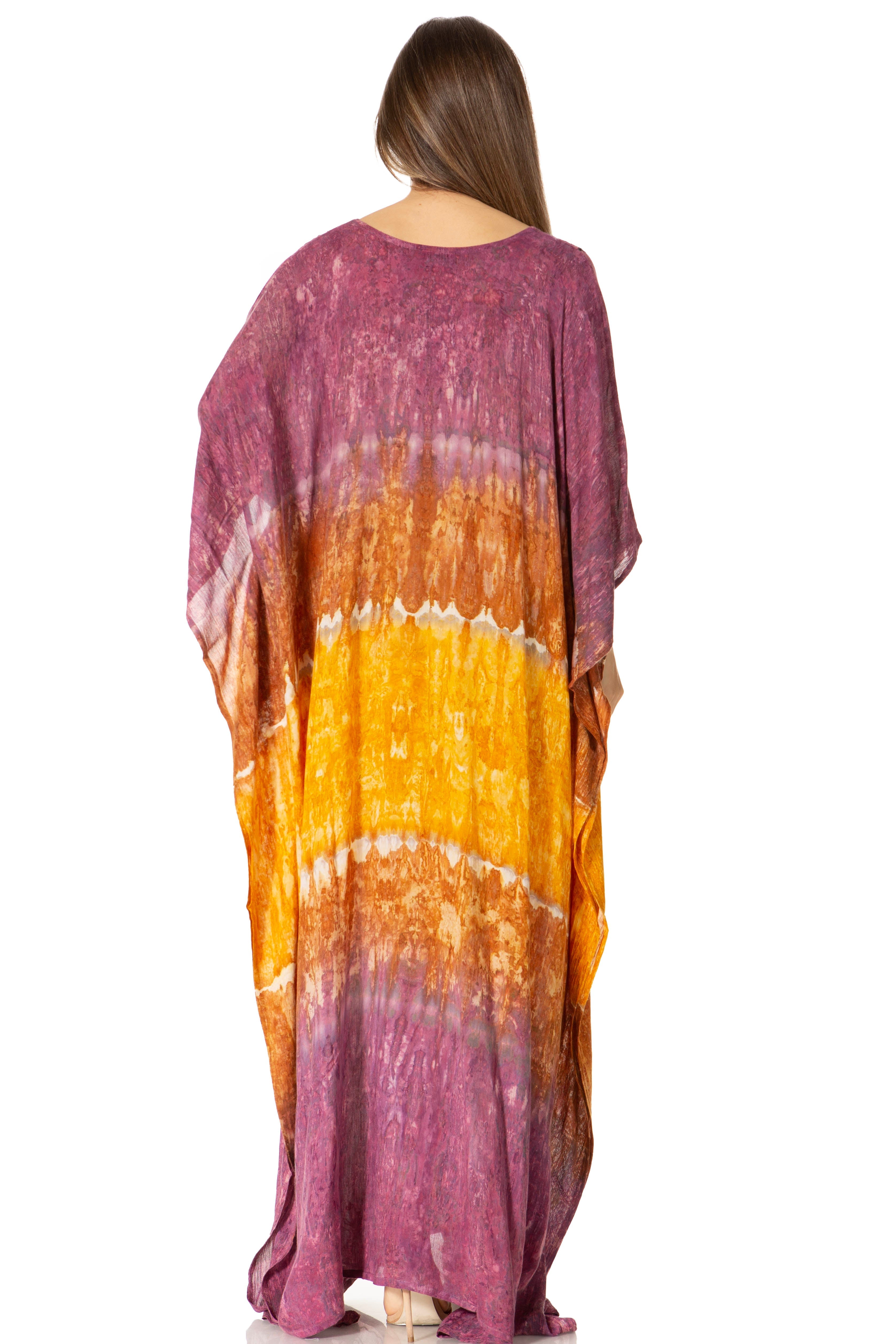 Woman wearing a tie-dye kimono-style garment with a gradient from purple to orange on a white background.