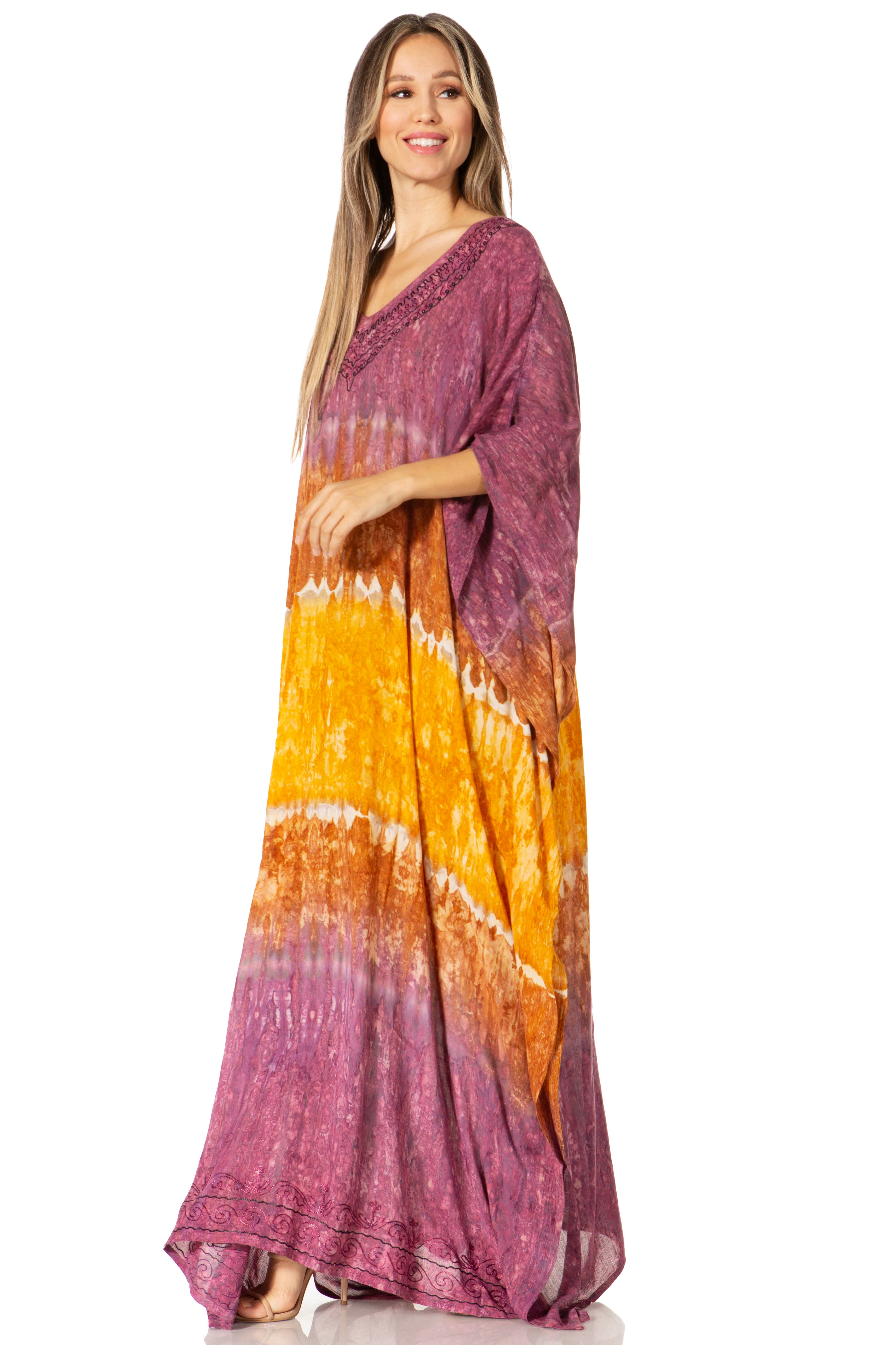 Woman wearing a tie-dye dress with a gradient from purple to yellow on a white background