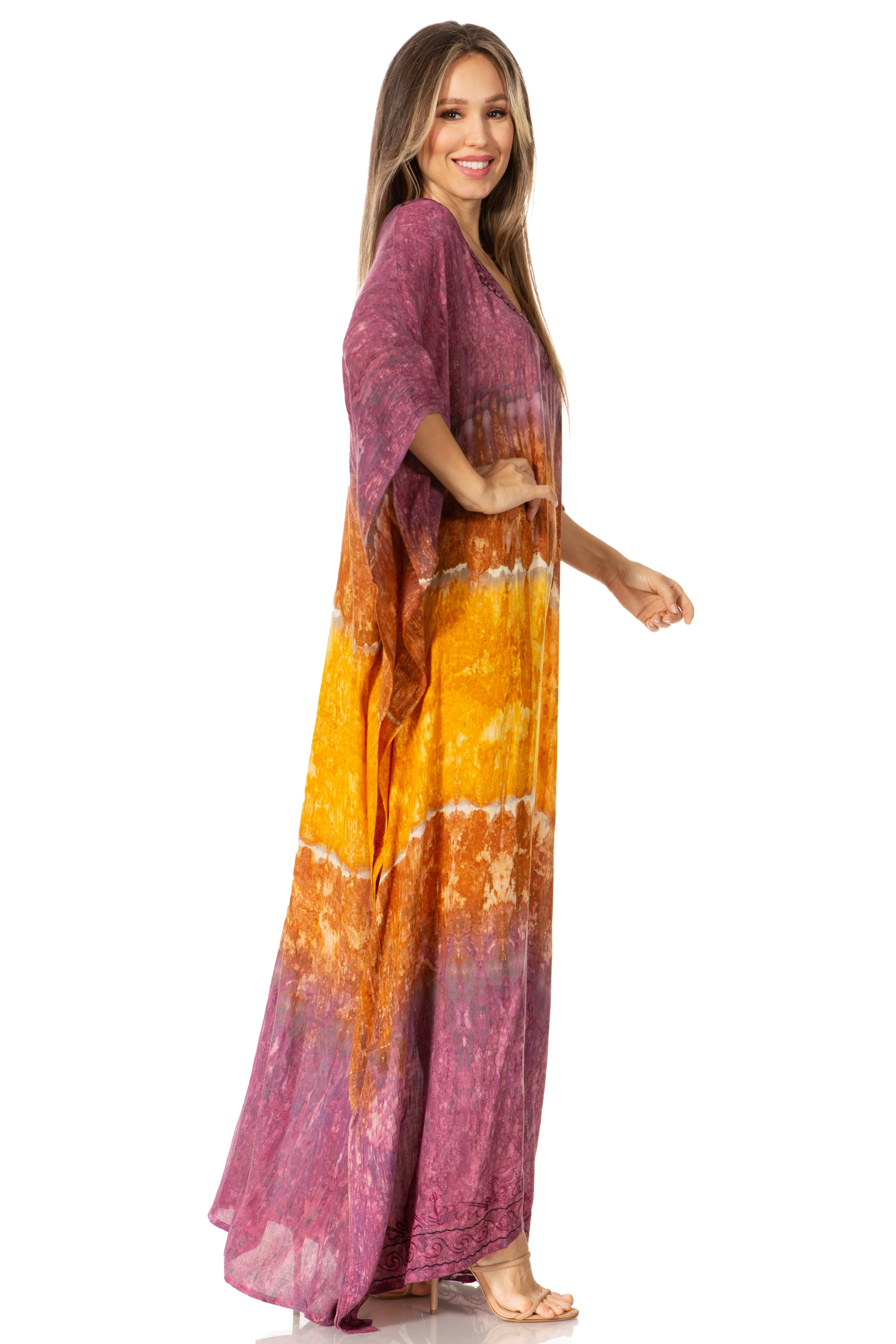 Woman wearing a colorful tie-dye dress with a white background