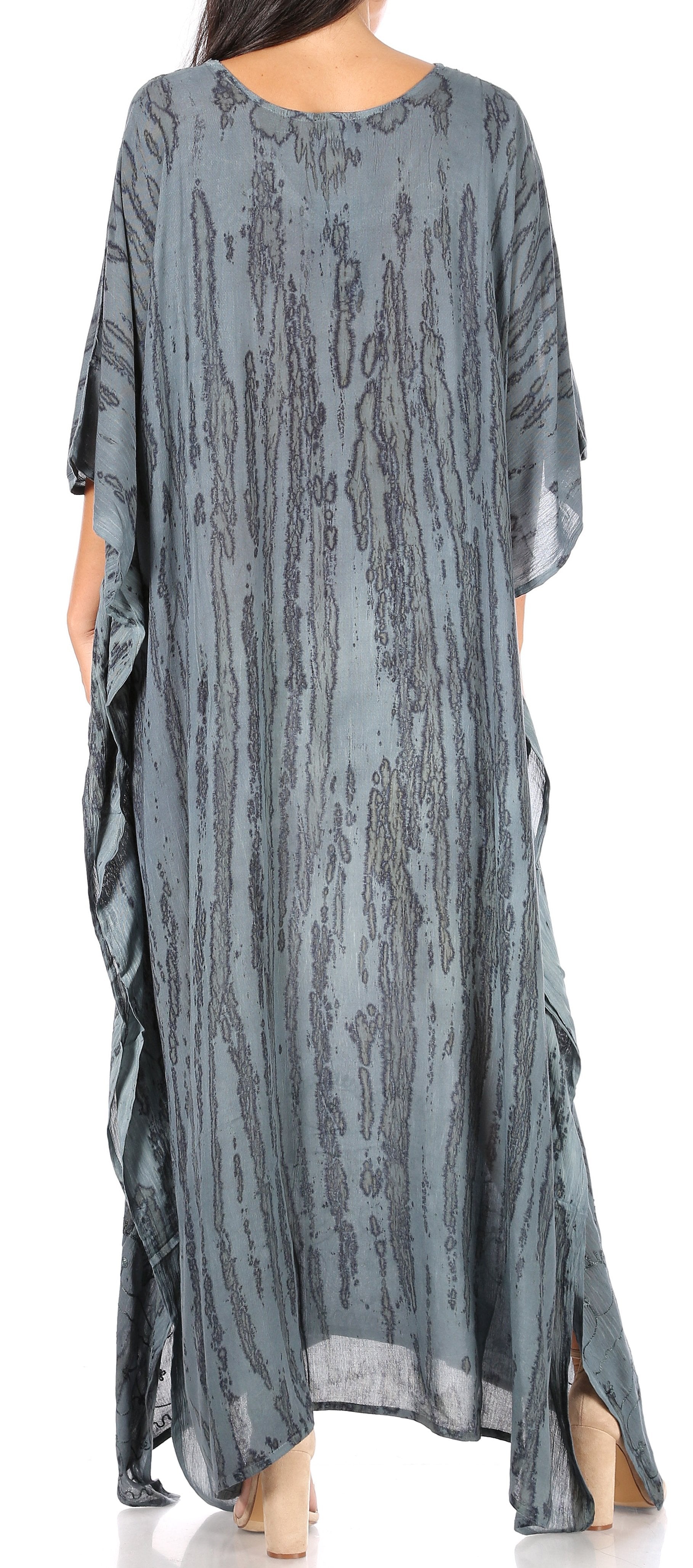 Long, flowing blue dress with a pattern on a plain background