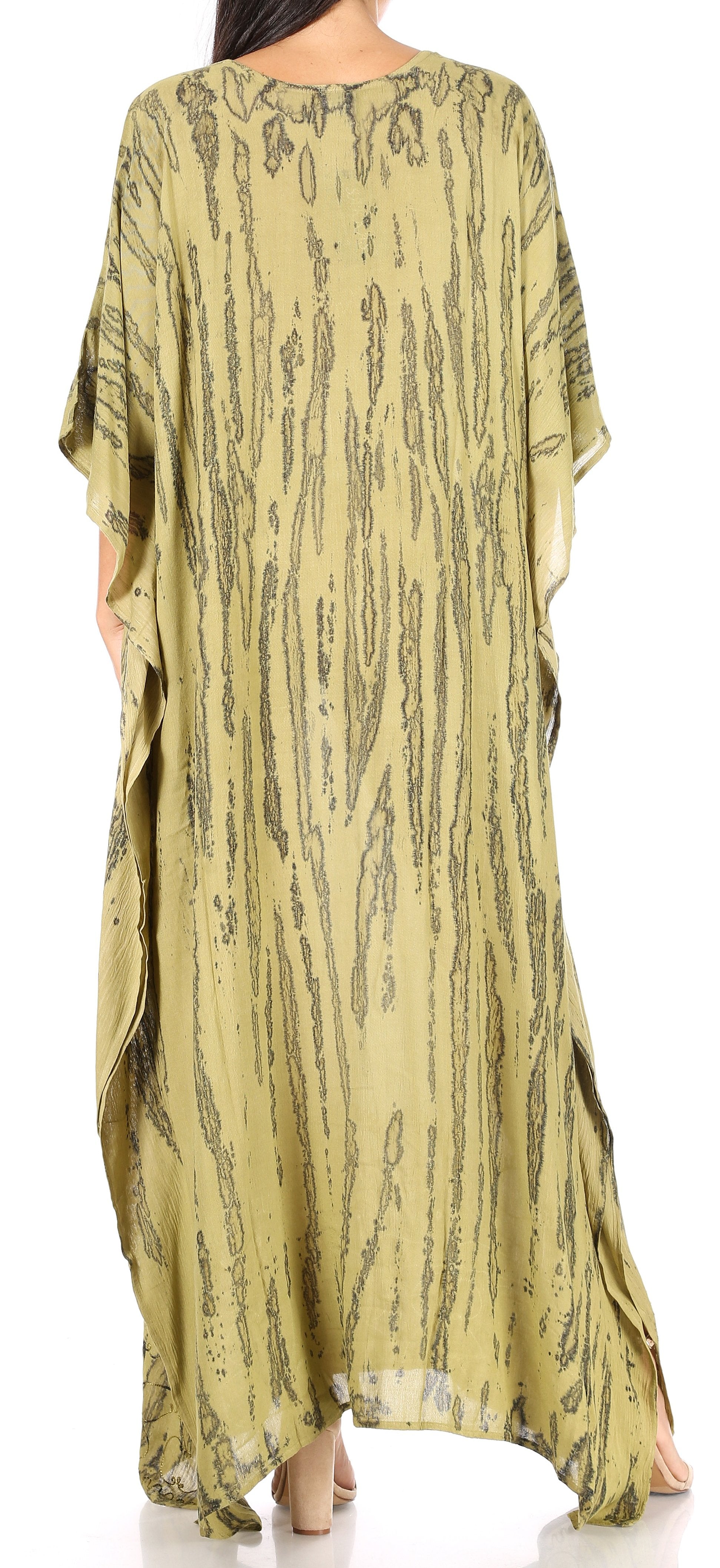 Long, light green dress with black pattern on a white background
