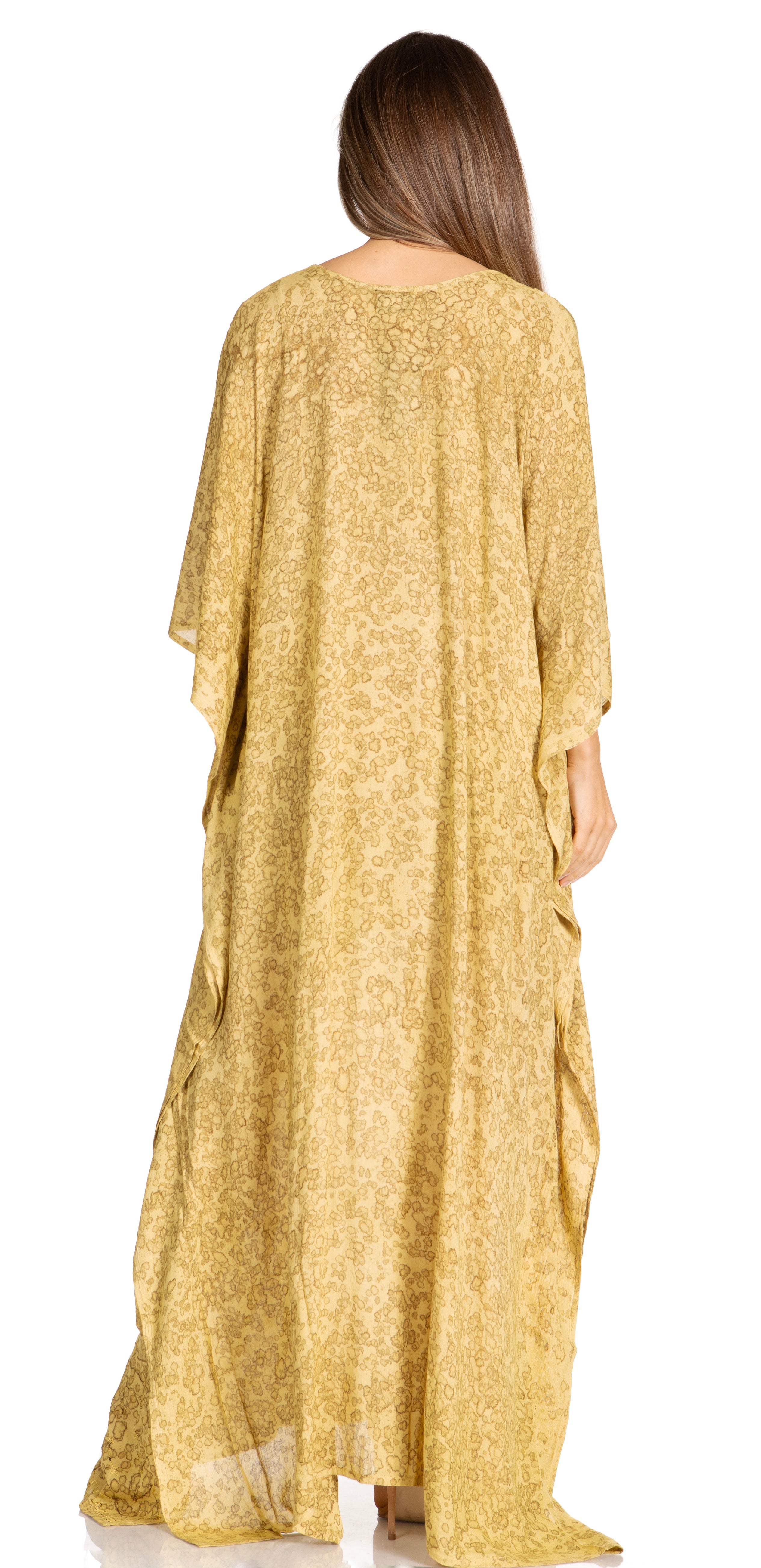 Woman wearing a long, light-colored dress with a subtle pattern on a white background