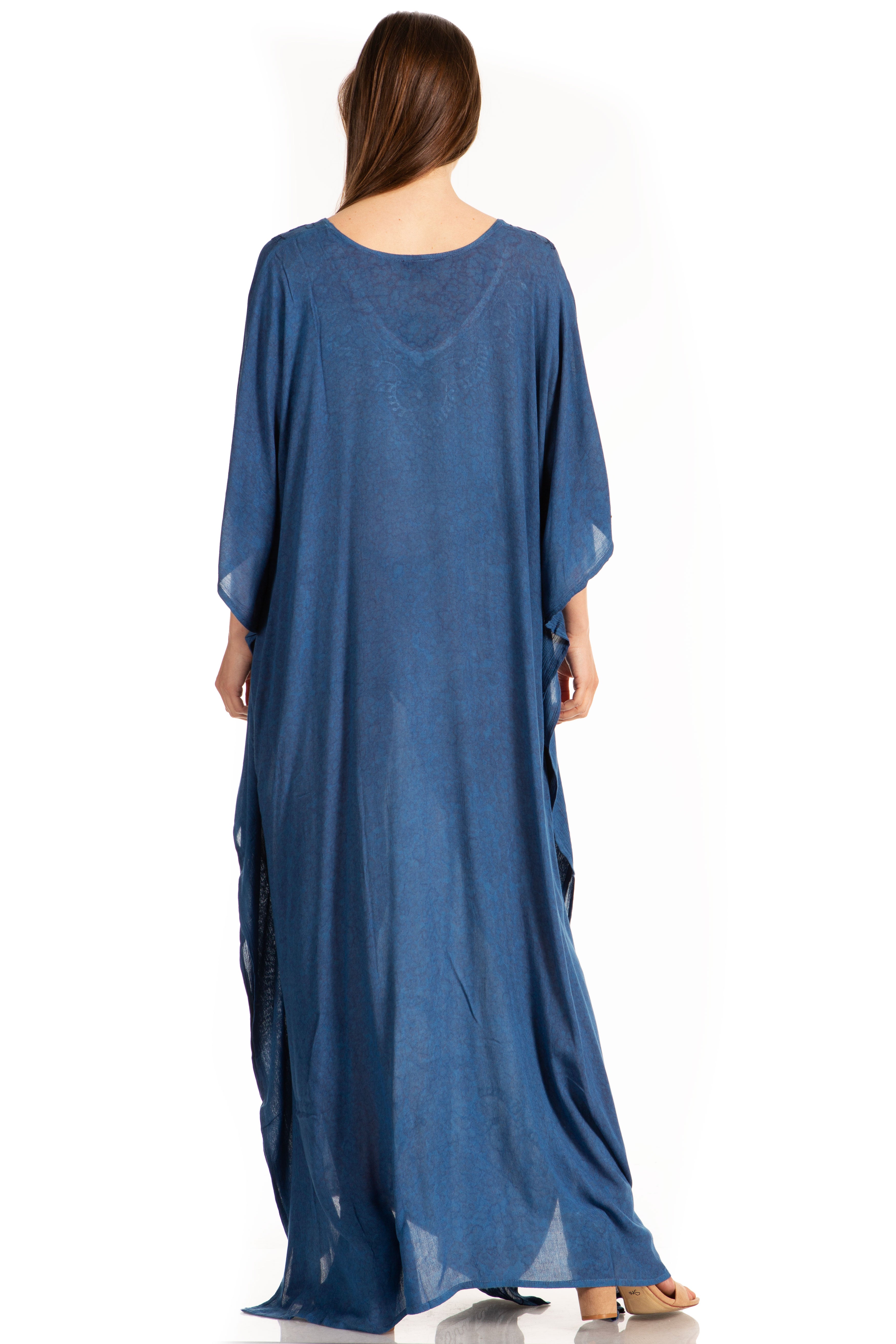 Woman wearing a blue maxi dress on a white background