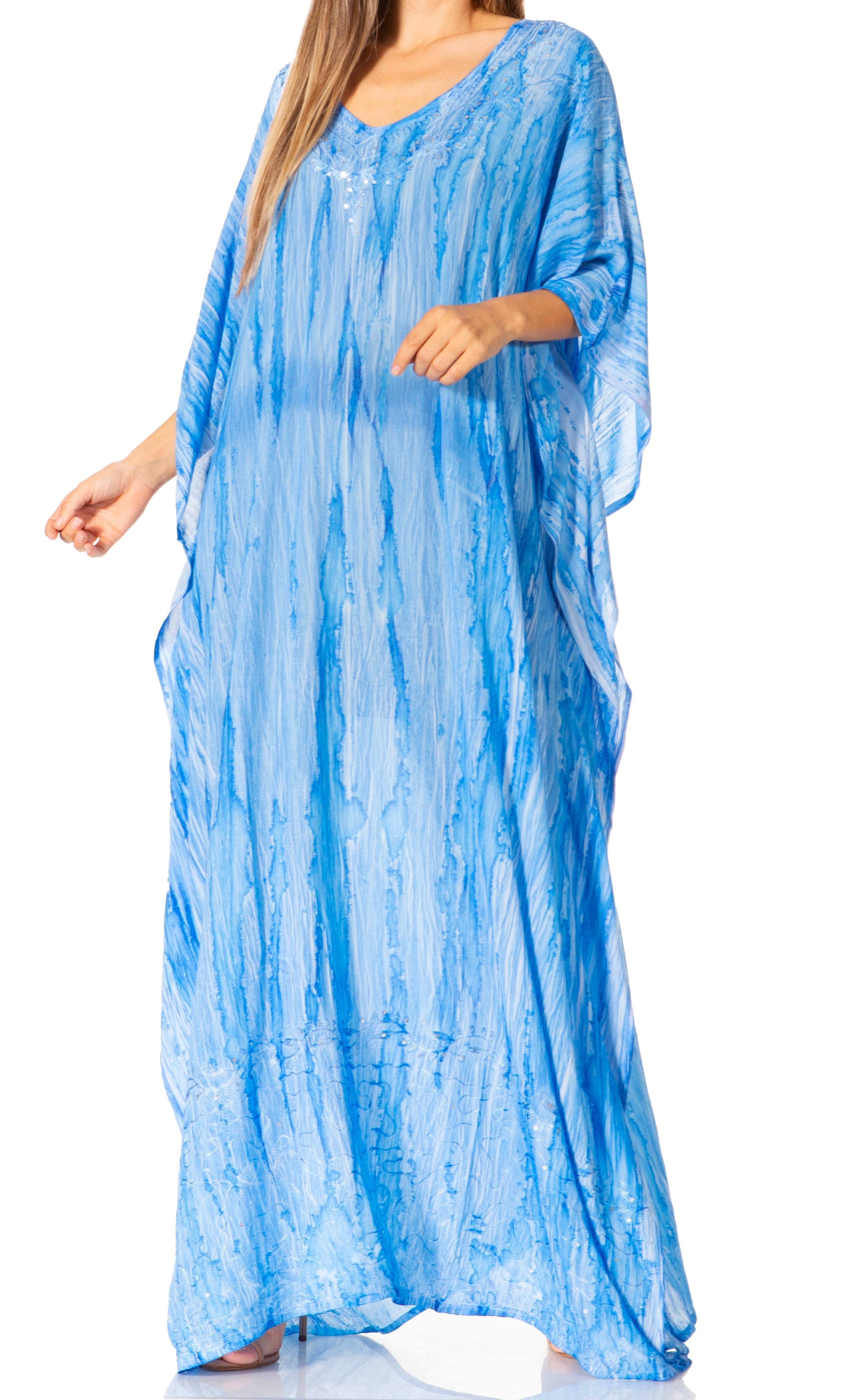 Woman wearing a blue tie-dye dress on a white background