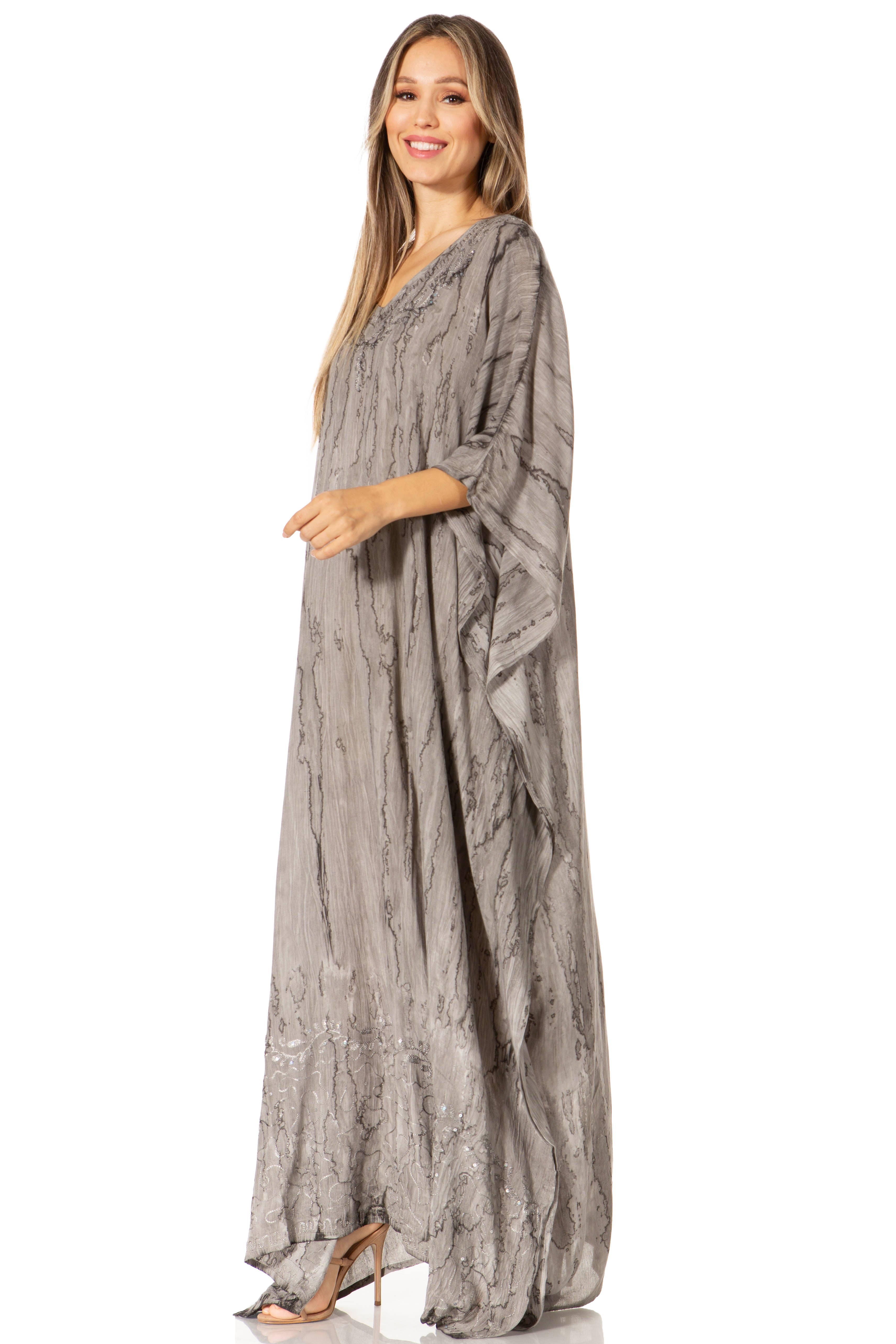 Woman wearing a long, flowing dress on a white background