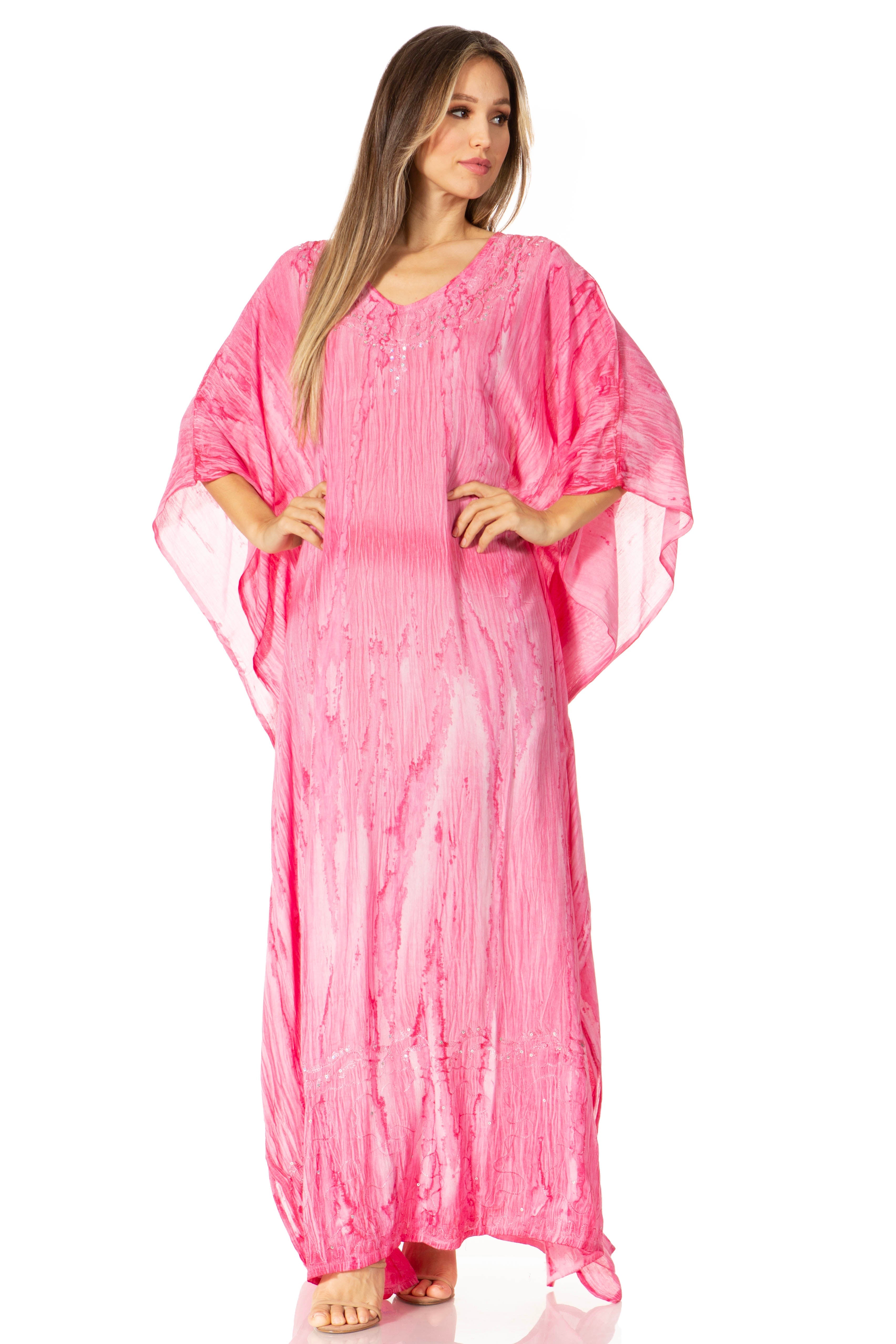 Woman wearing a pink caftan on a white background