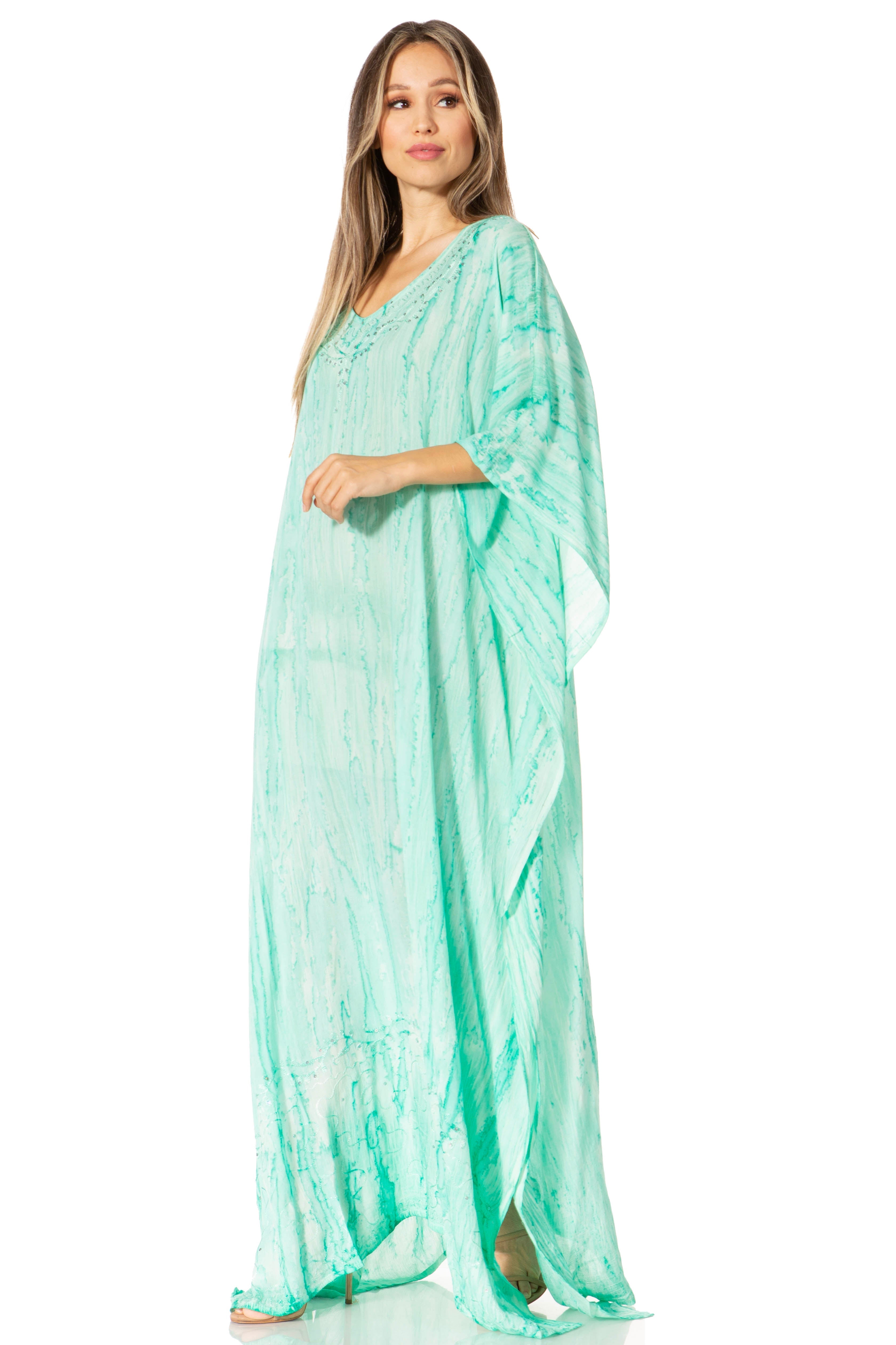 Woman wearing a light green dress with a white background