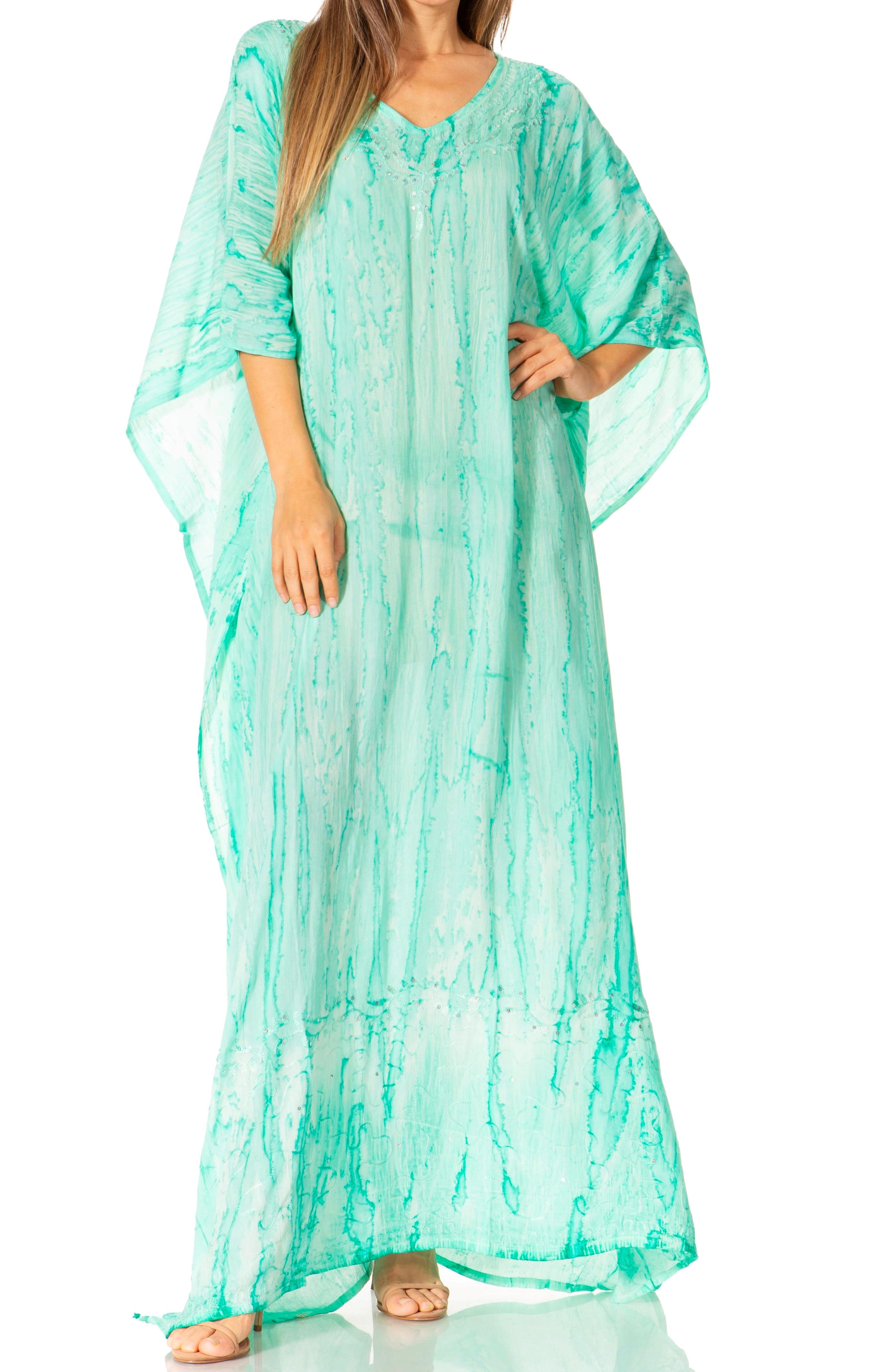 Woman wearing a green caftan on a white background