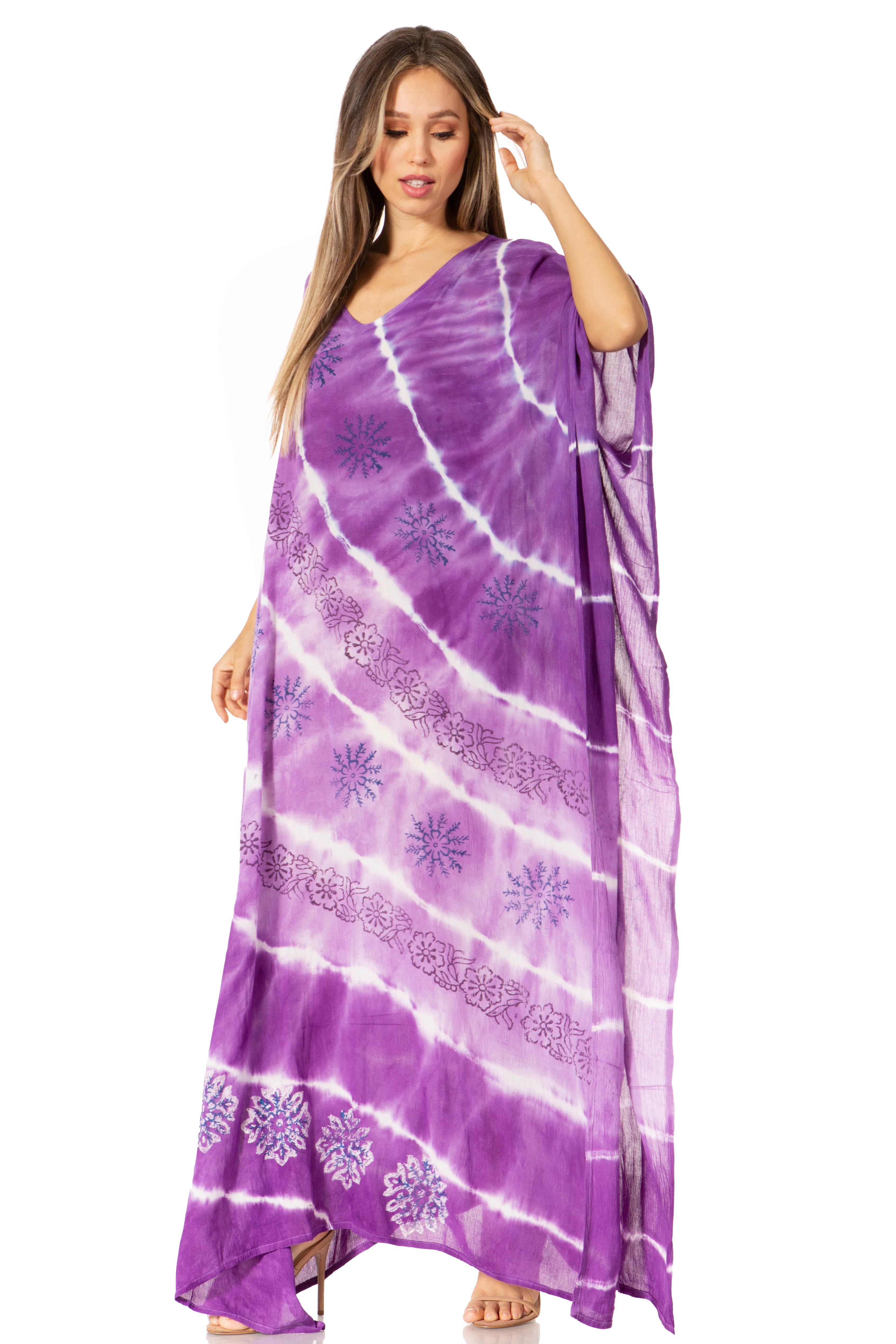 Woman wearing a purple tie-dye dress with white patterns on a white background