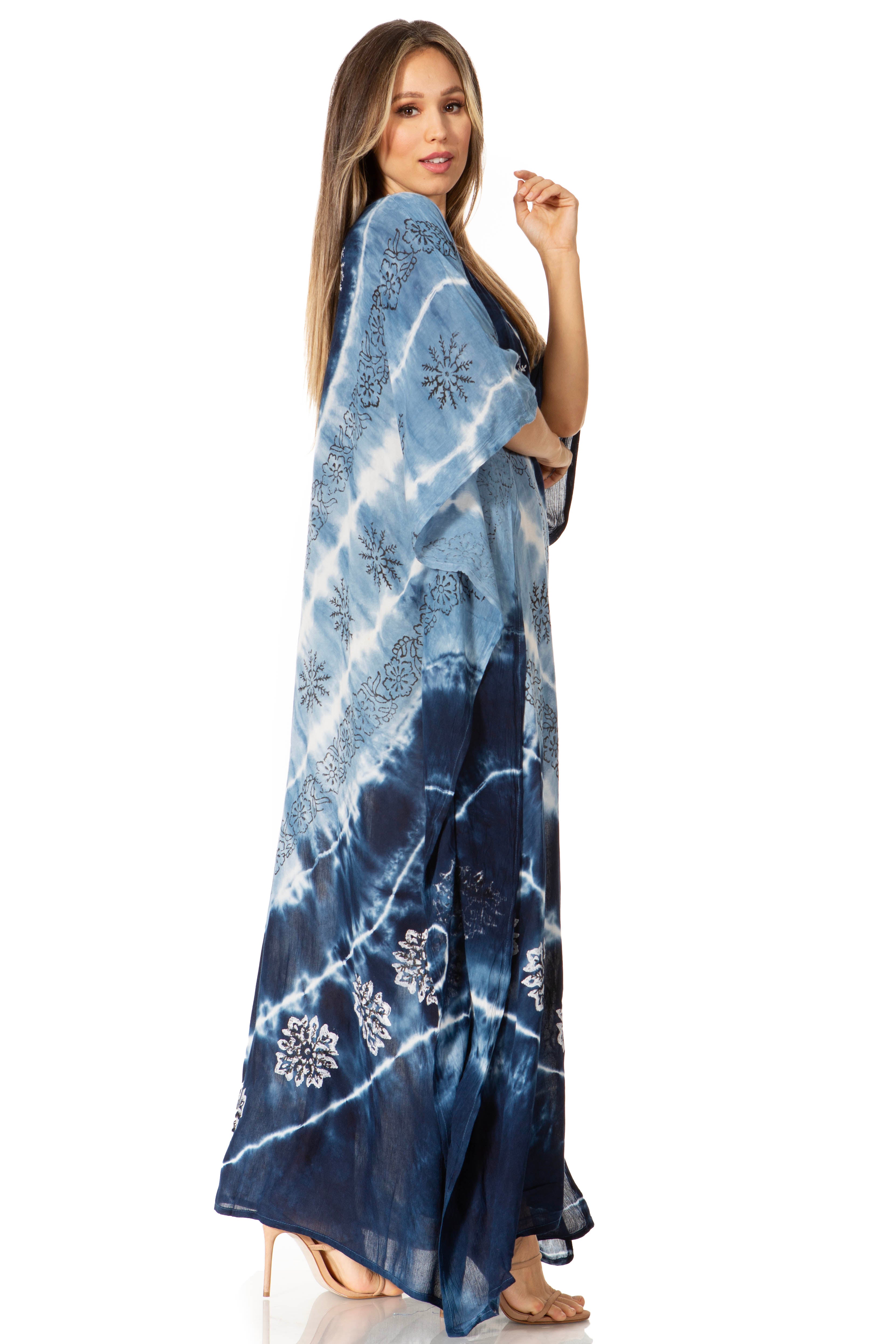 Woman wearing a blue tie-dye dress on a white background