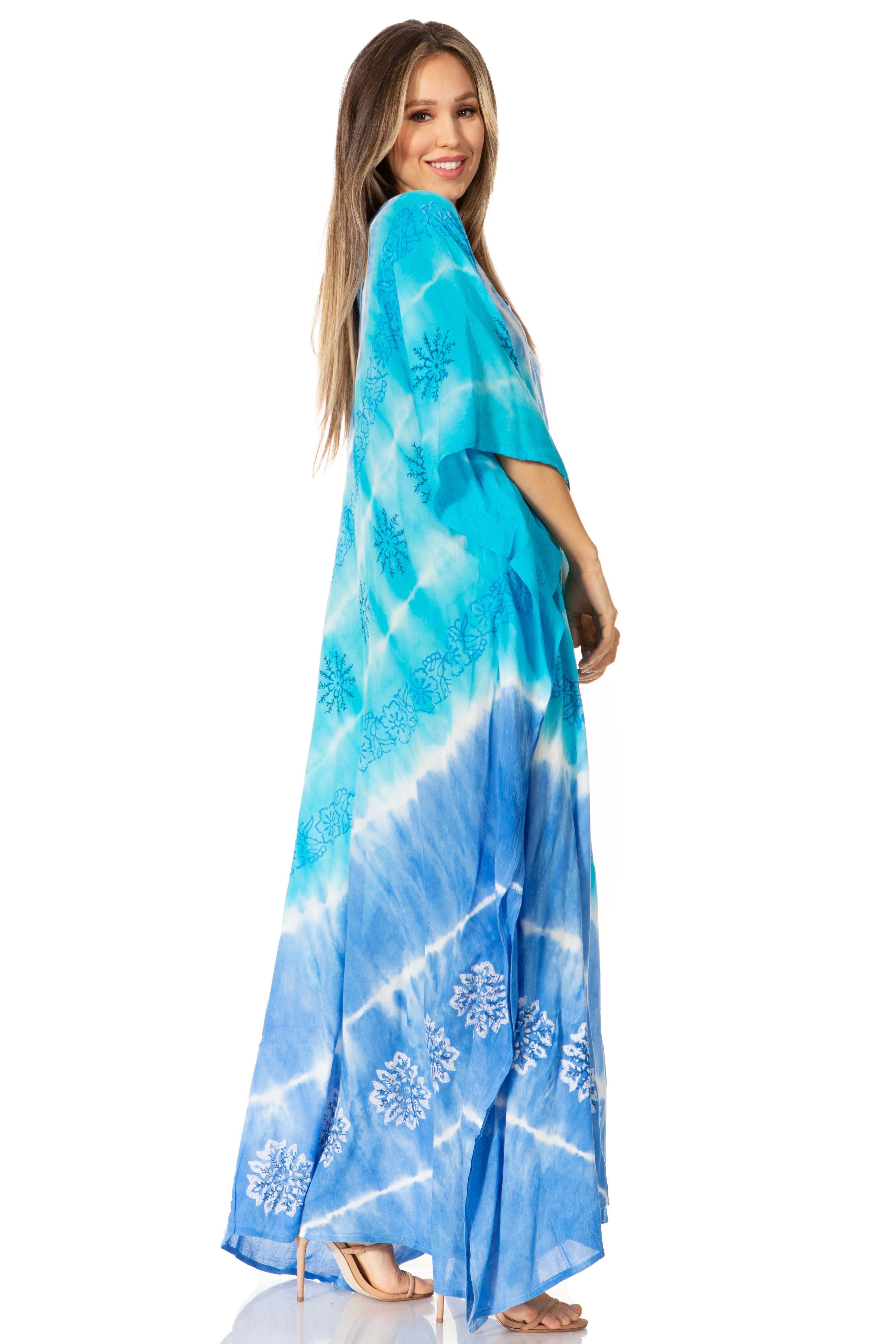 Woman wearing a blue tie-dye dress on a white background