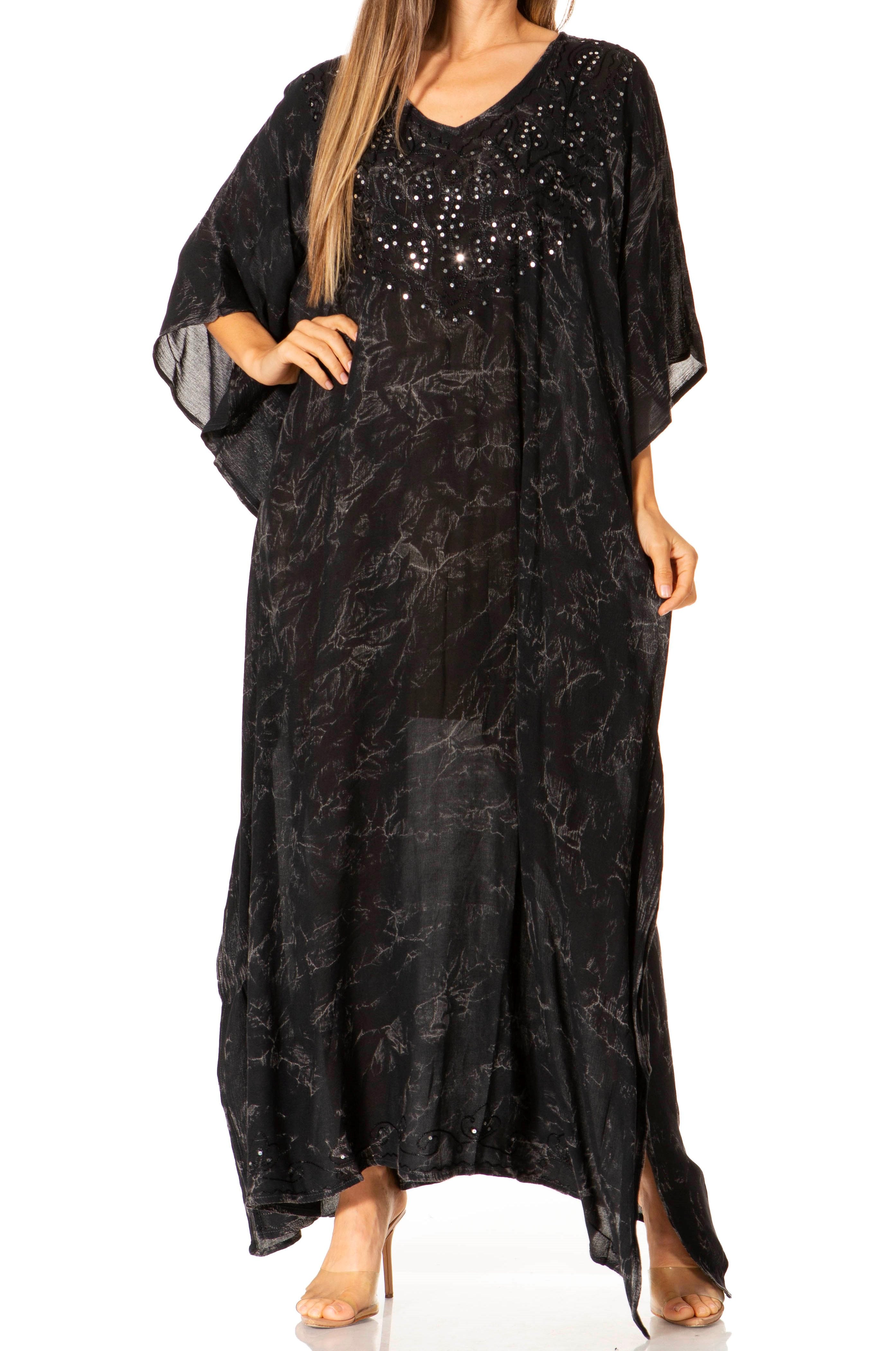 Black patterned dress with sheer sleeves on a white background