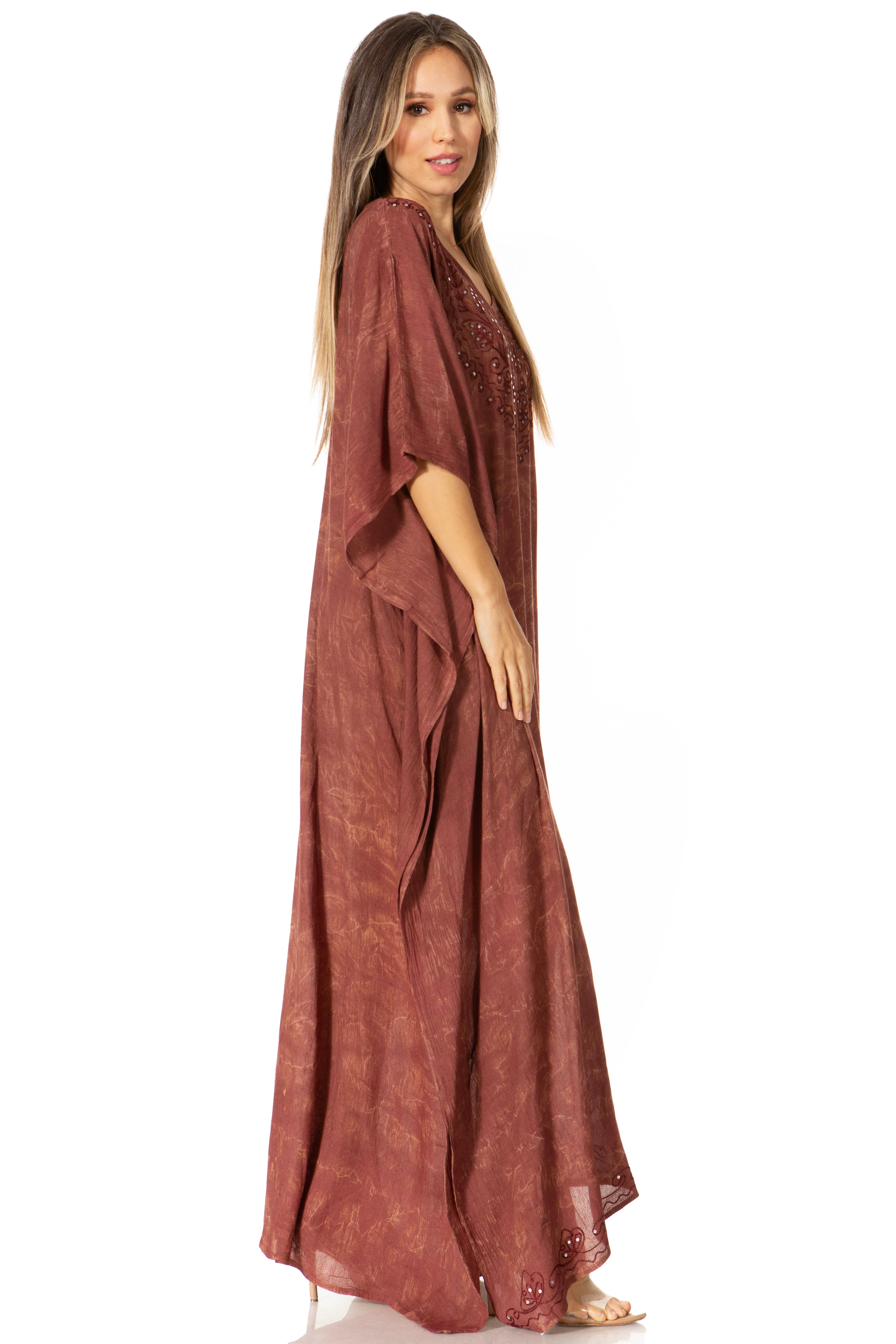 Woman wearing a long rust-colored dress on a white background