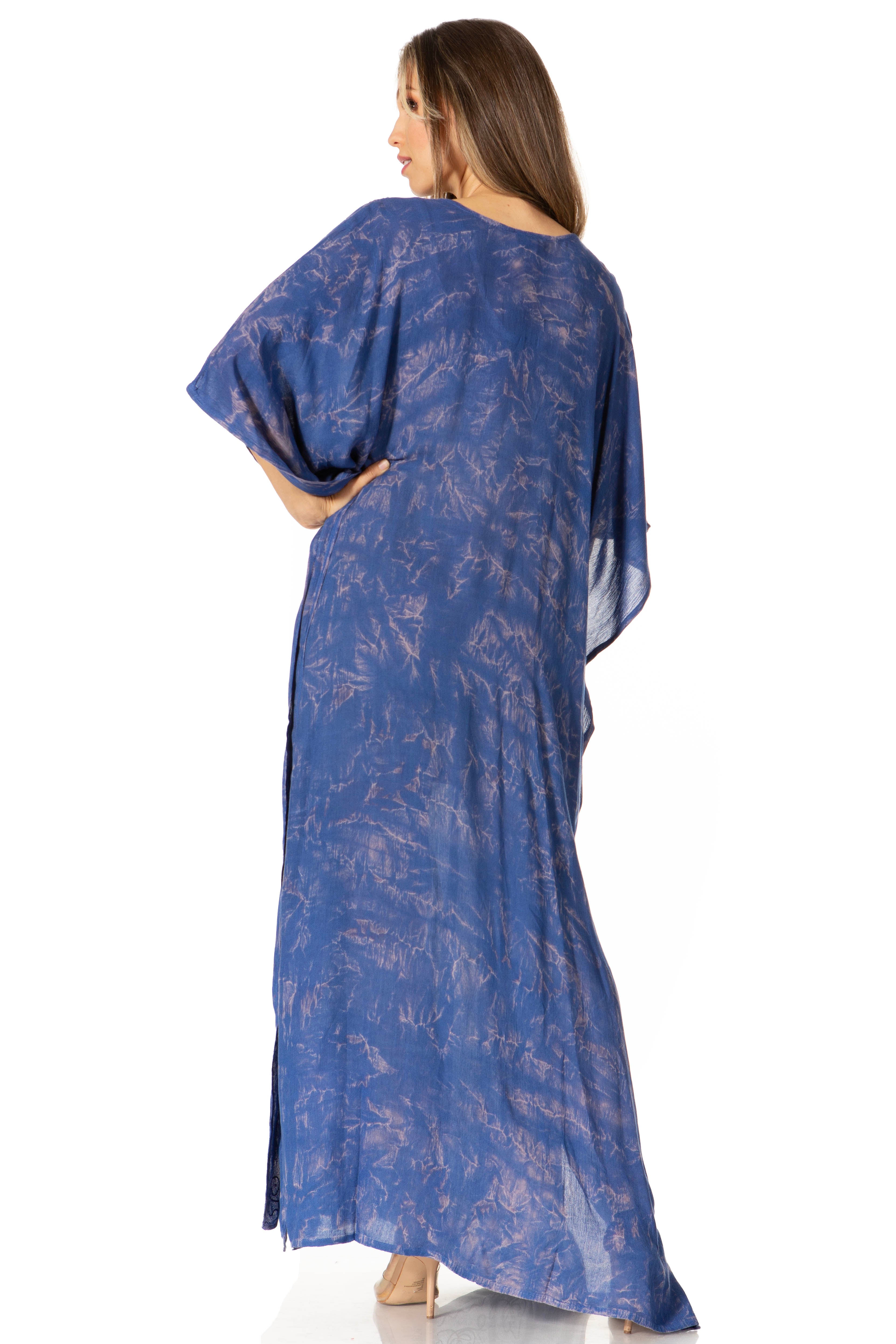 Woman wearing a blue patterned dress on a white background