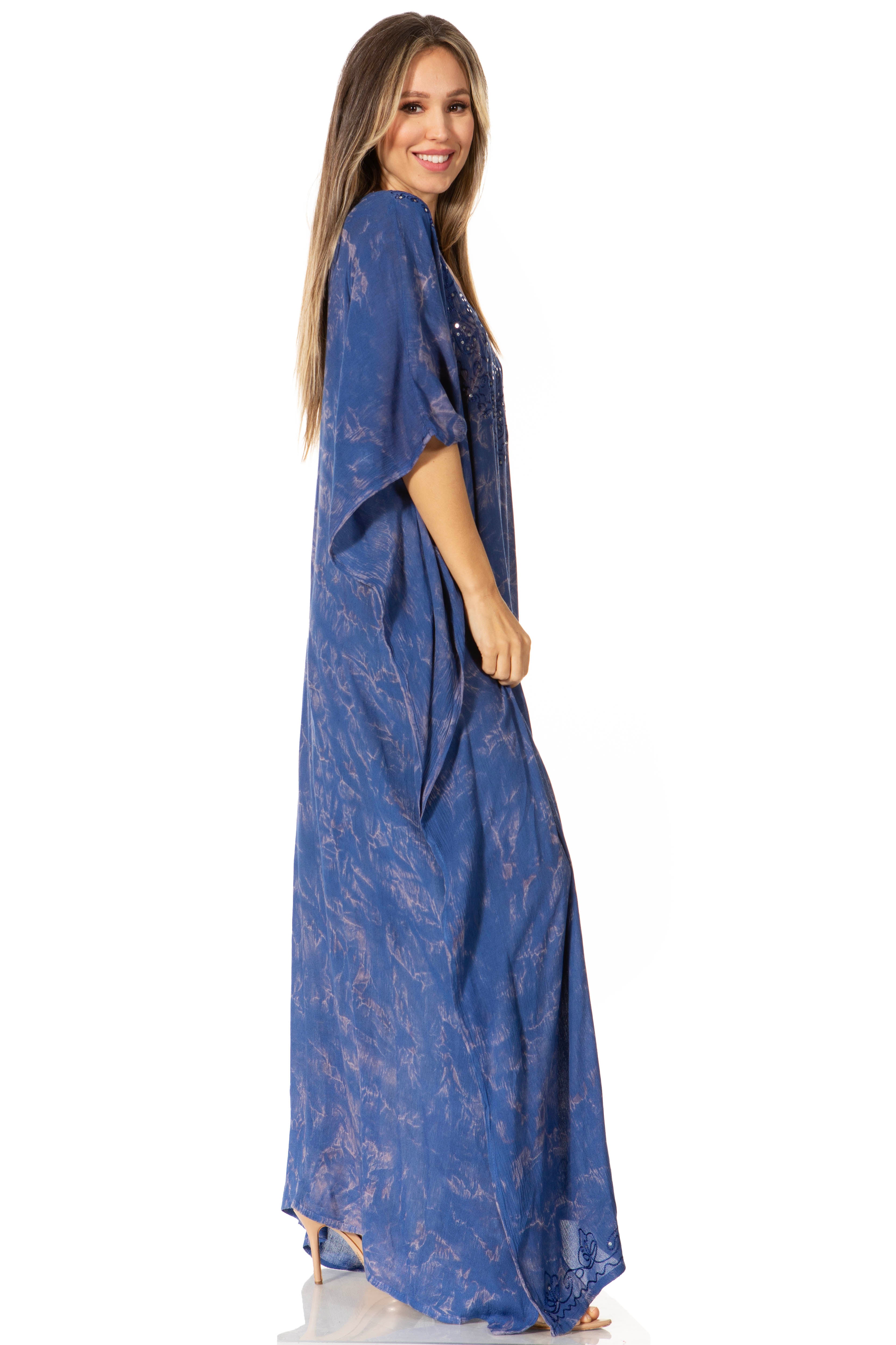 Woman wearing a blue patterned dress on a white background