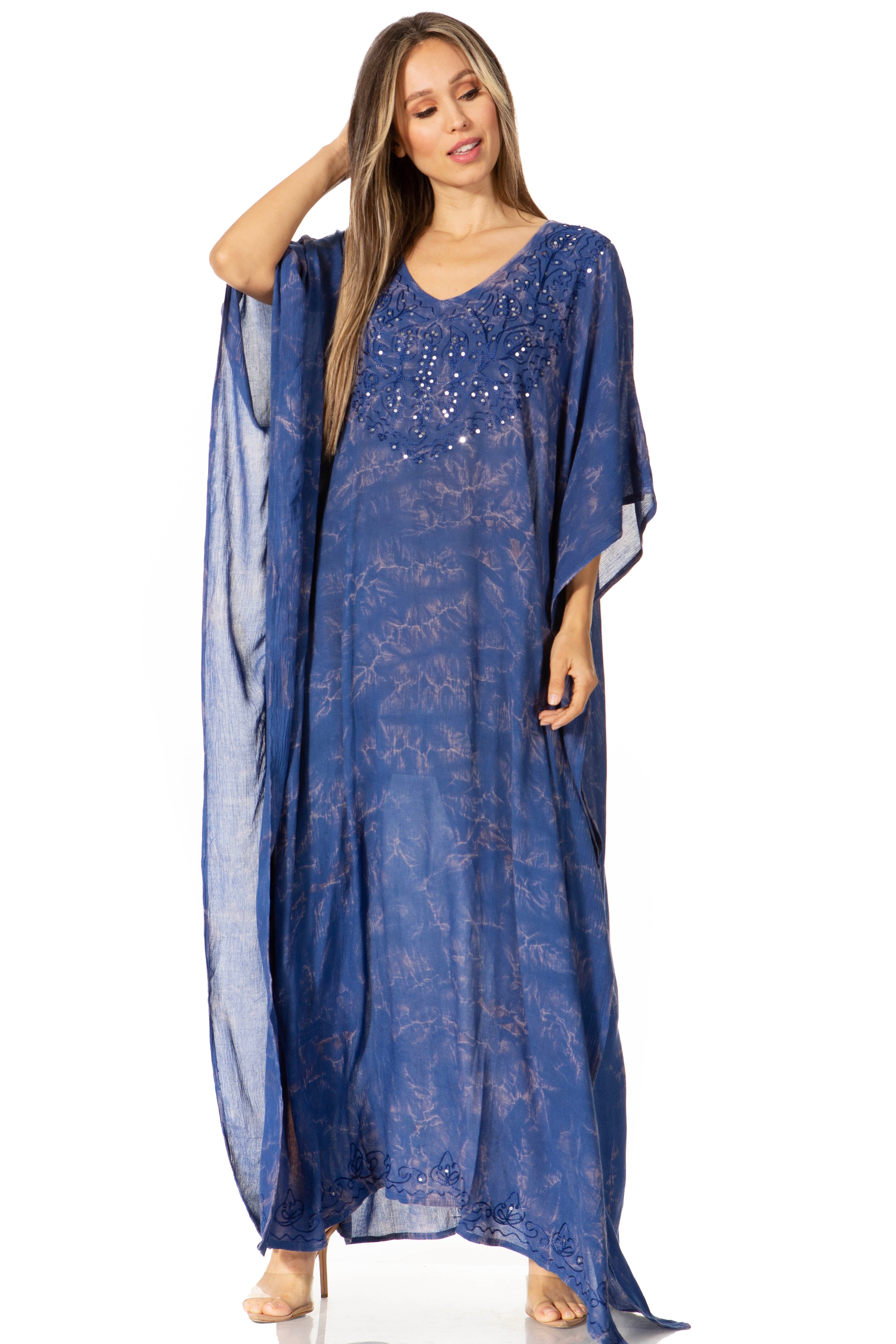 Woman wearing a blue patterned kaftan on a white background
