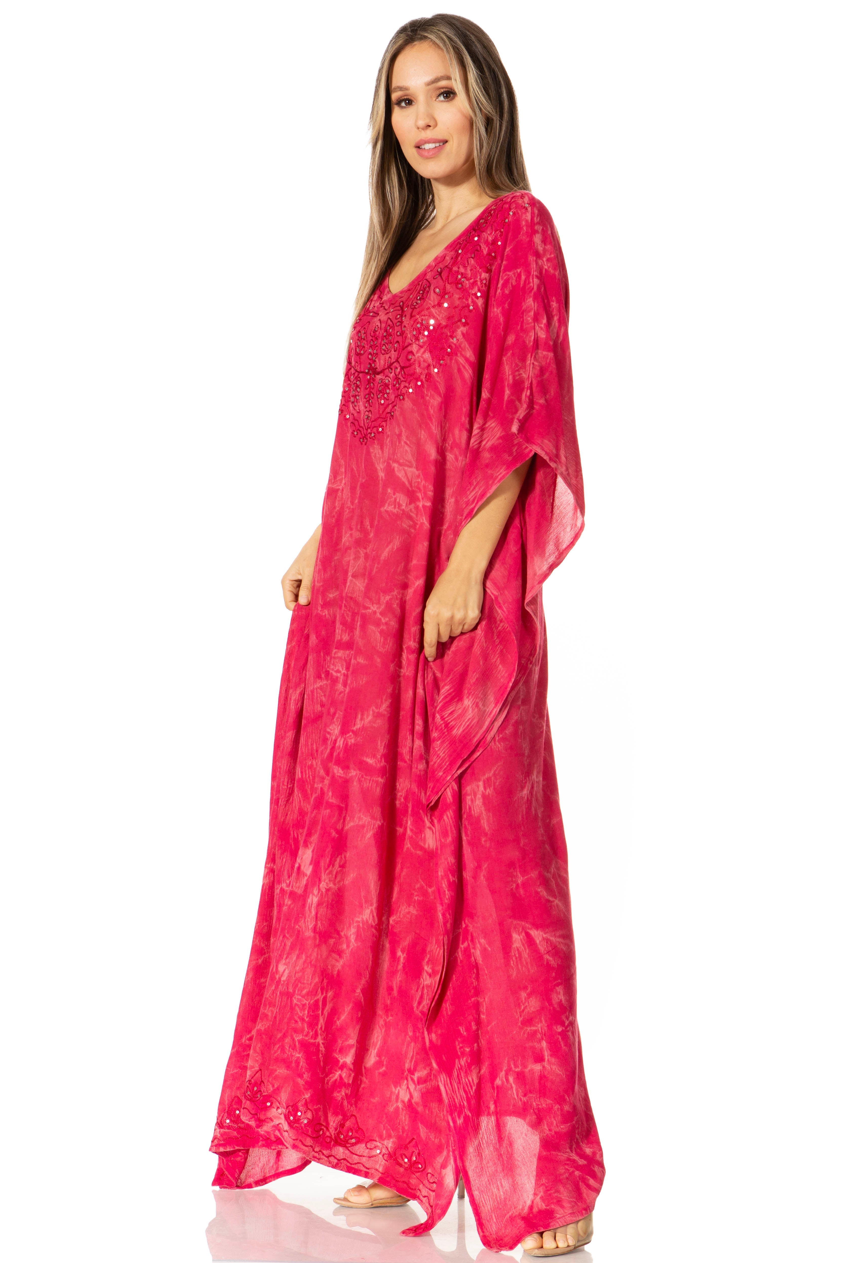 Woman wearing a pink dress with a white background