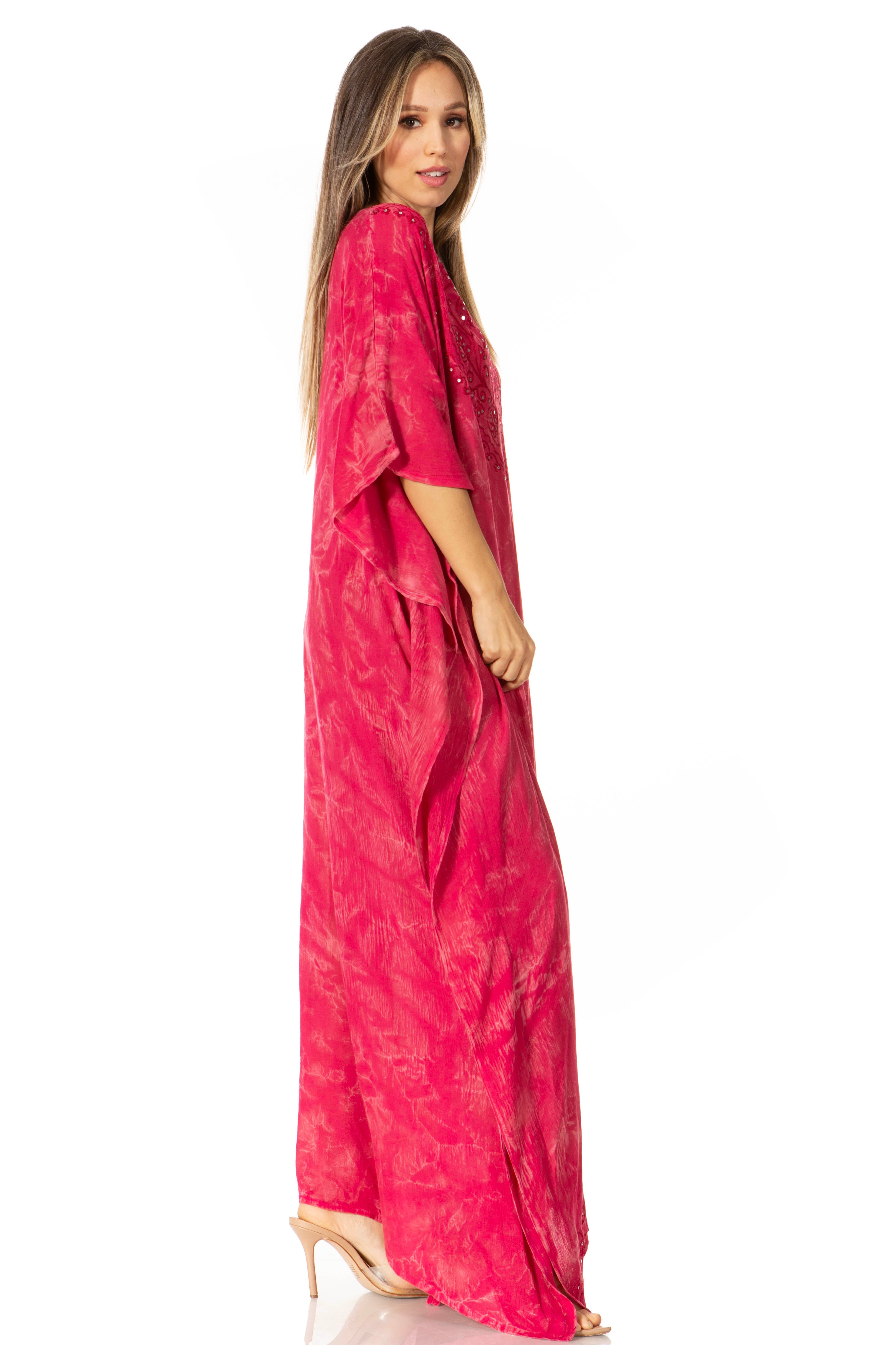 Woman wearing a pink dress with a white background
