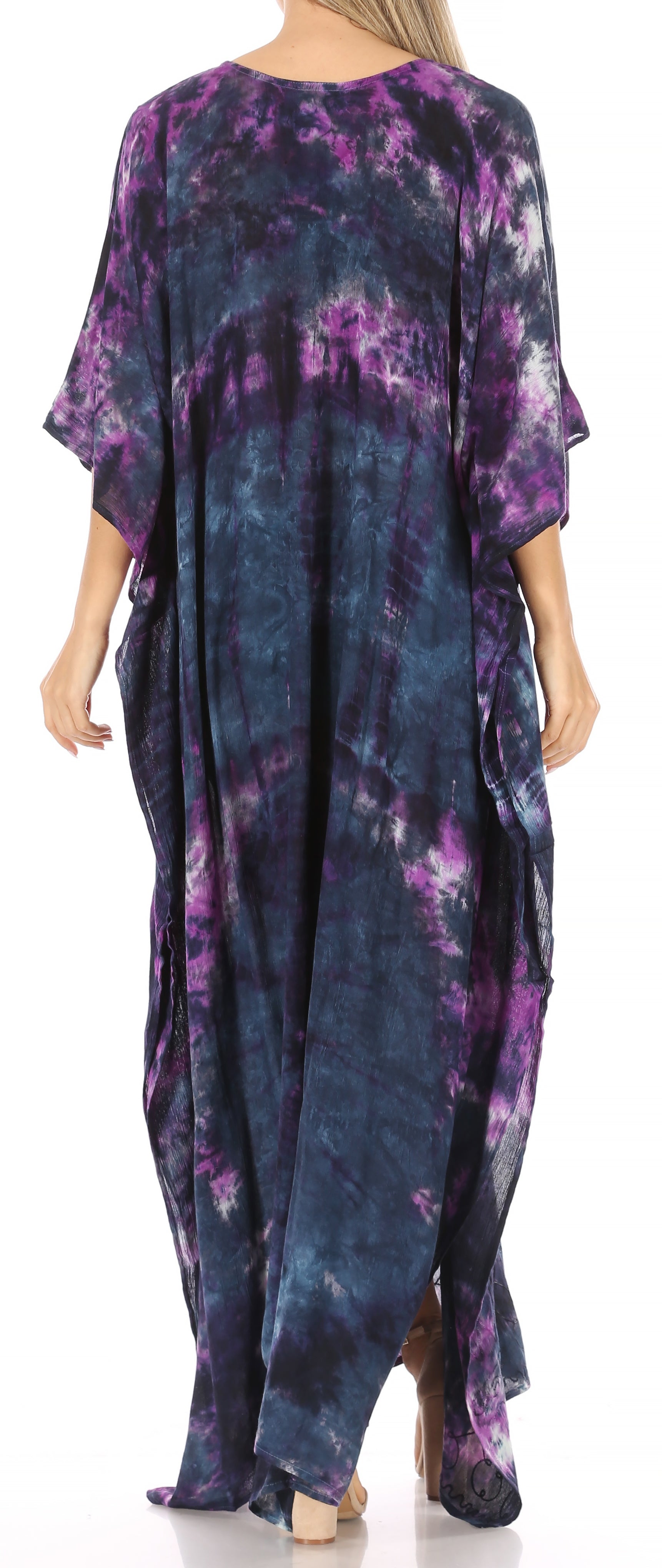 Purple and blue tie-dye dress worn by a model on a white background