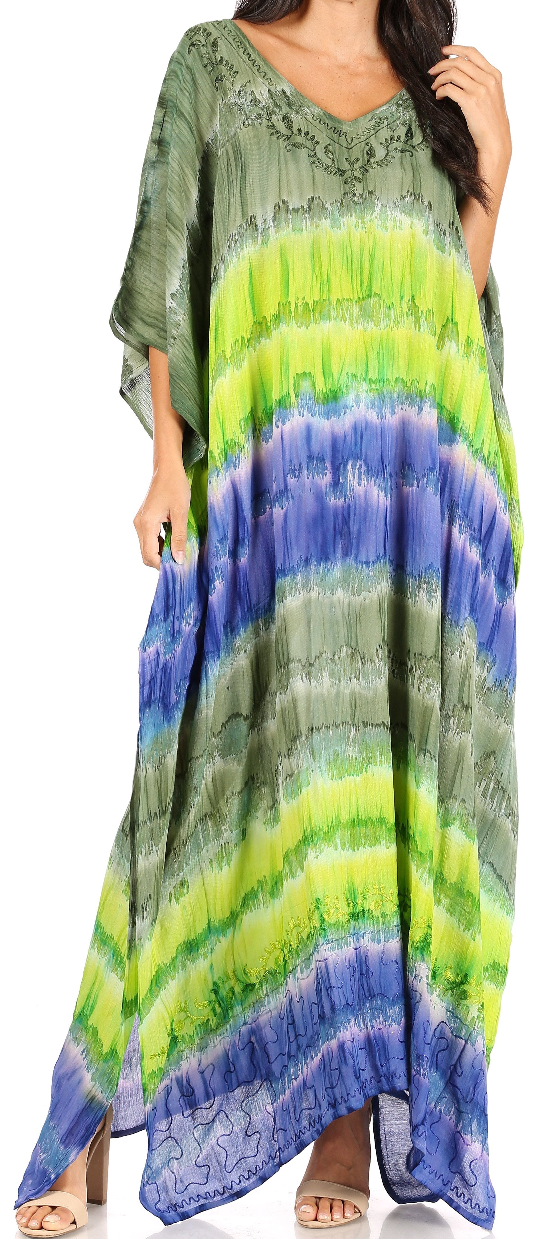 Woman wearing a long, colorful dress with a gradient pattern.