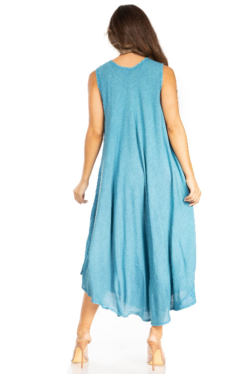 Woman wearing a light blue sleeveless dress on a white background