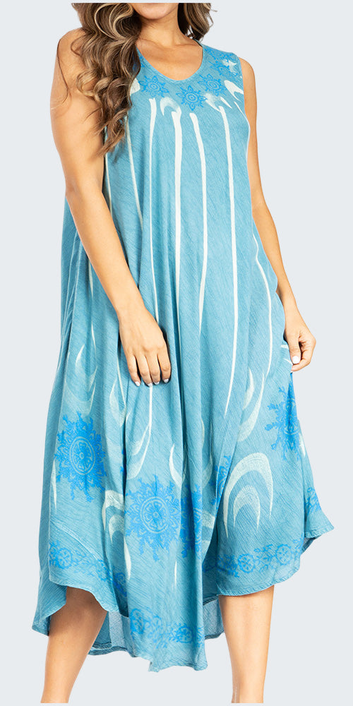 Woman wearing a blue sleeveless dress with white patterns on a white background