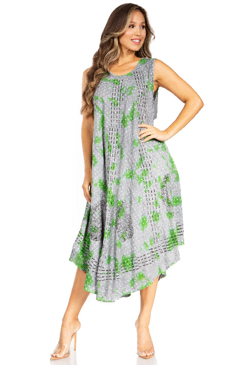 Woman wearing a gray dress with green floral pattern on a white background