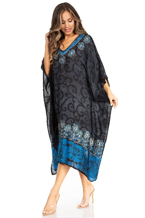 Woman wearing a black and blue patterned dress on a white background