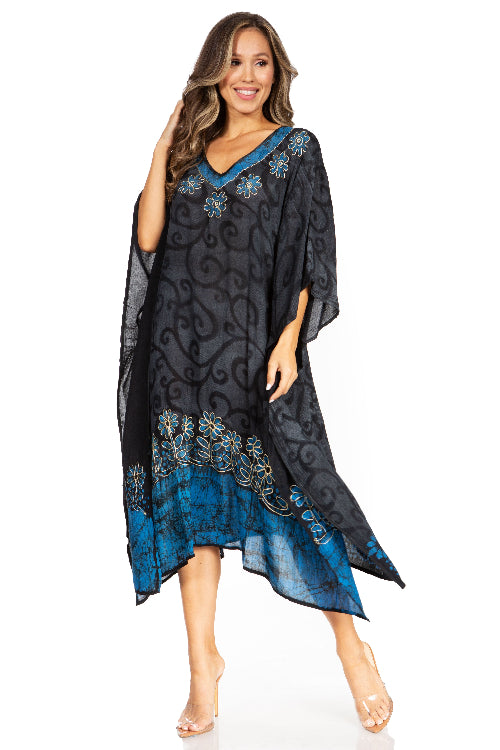 Woman wearing a black and blue patterned dress on a white background
