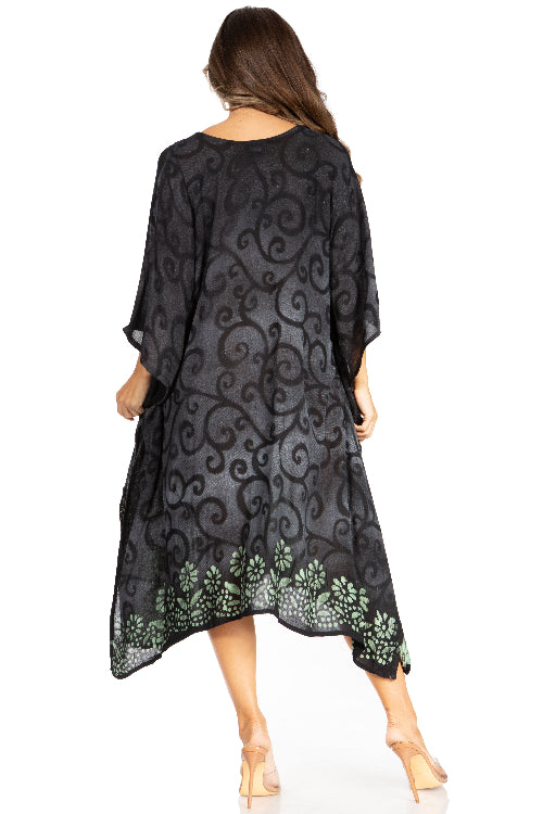Woman wearing a black patterned dress on a white background