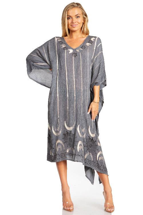 Woman wearing a gray dress with moon pattern on a white background