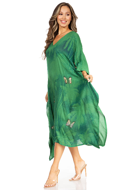 Woman wearing a green dress with butterfly patterns on a white background