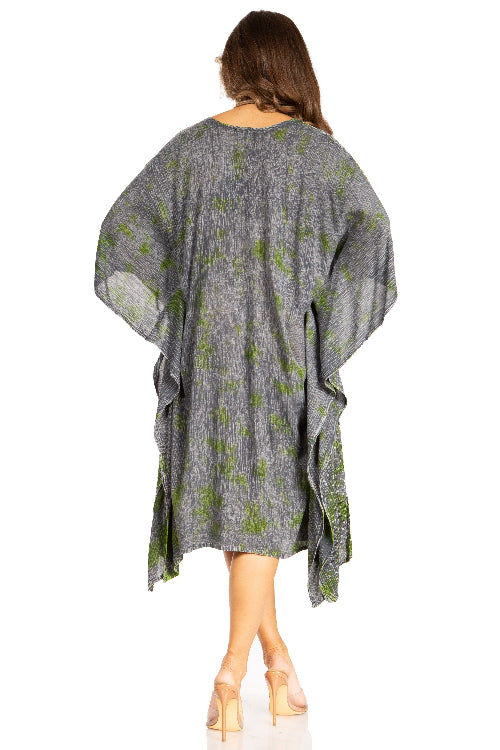Woman wearing a gray and green patterned dress on a white background