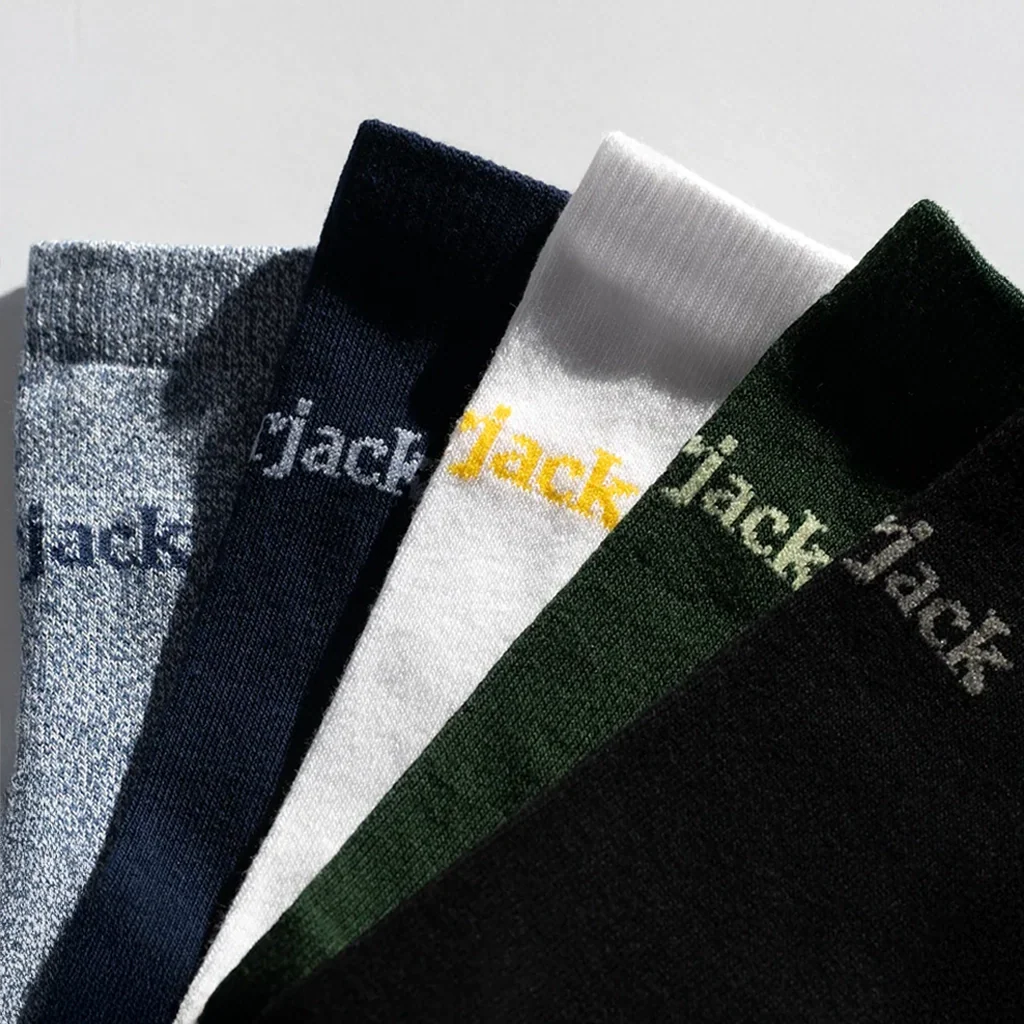 Five pairs of socks in different colors with 'Jack' branding on a light gray background.